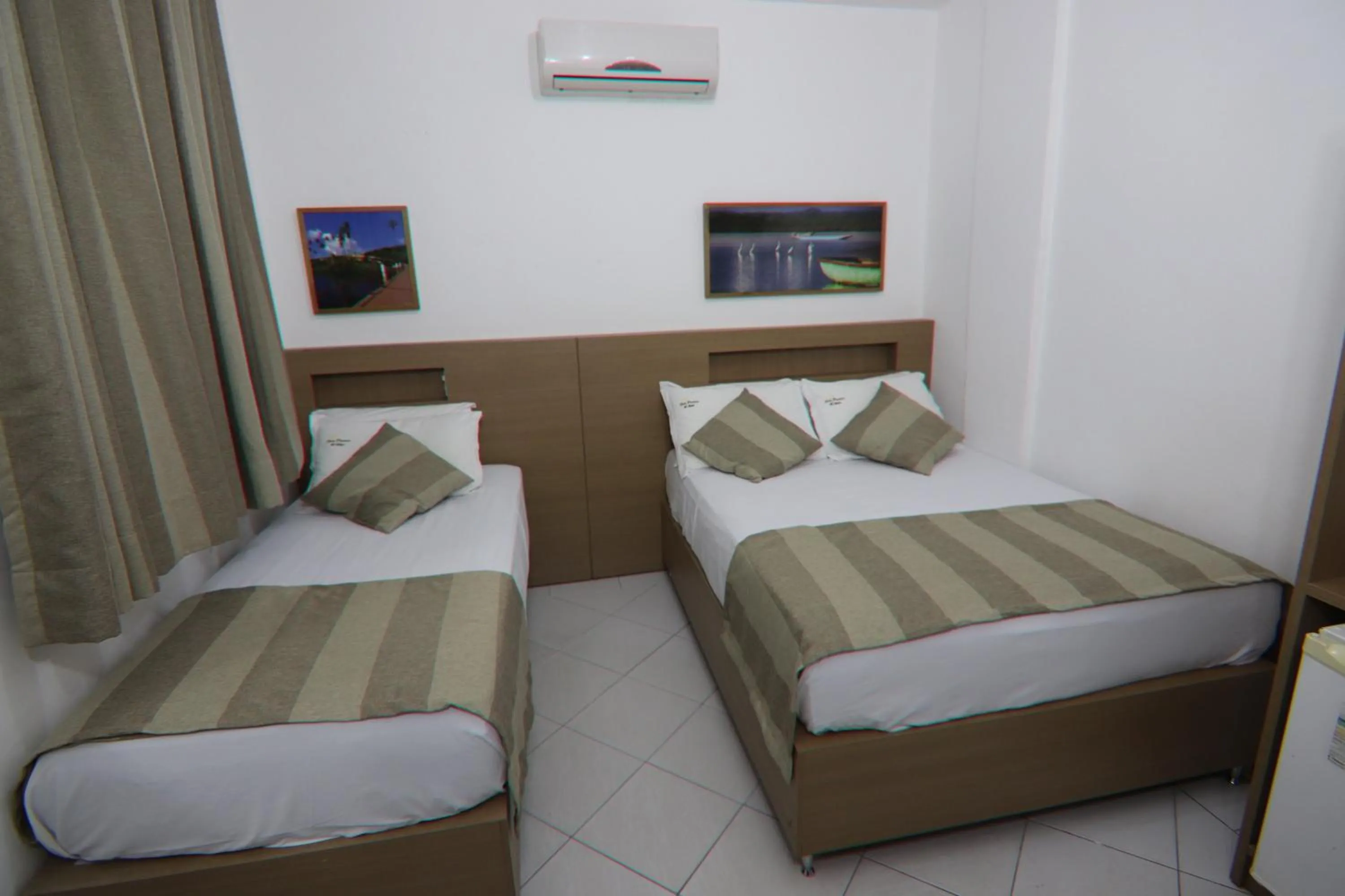Bed in Hotel Dom Passos