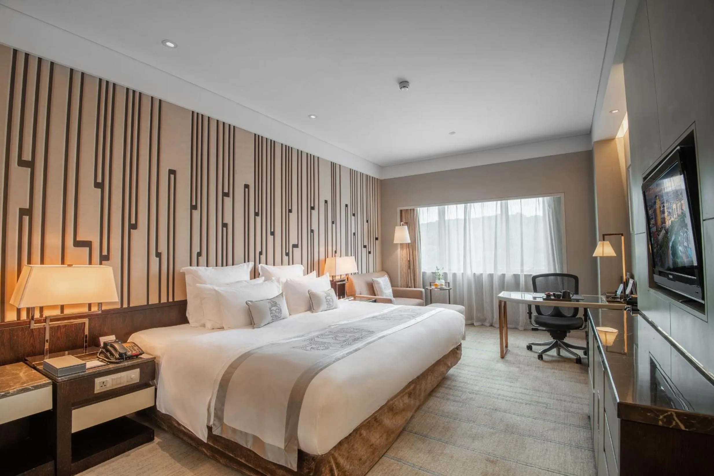 Bed in Grand Pacific Hotel Ningbo