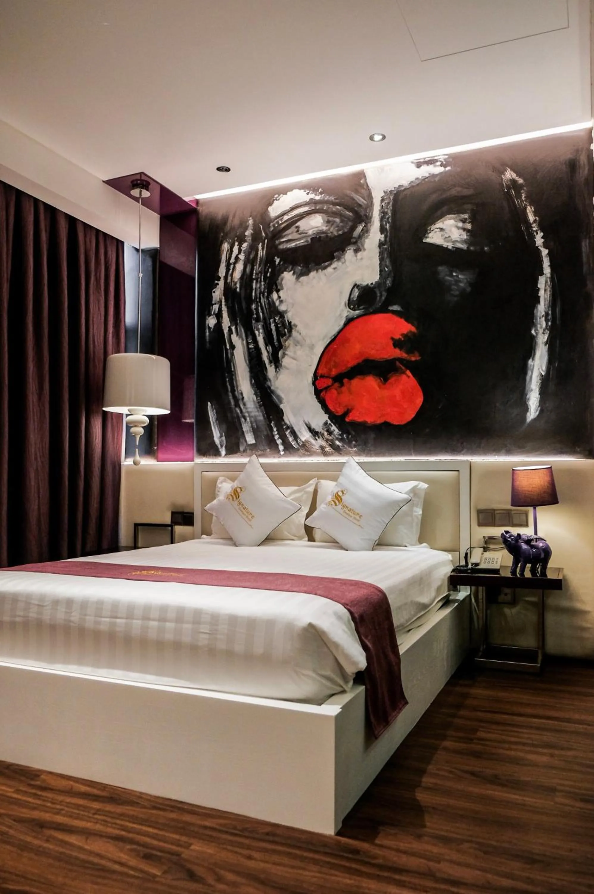 Bed in Signature Boutique Hotel