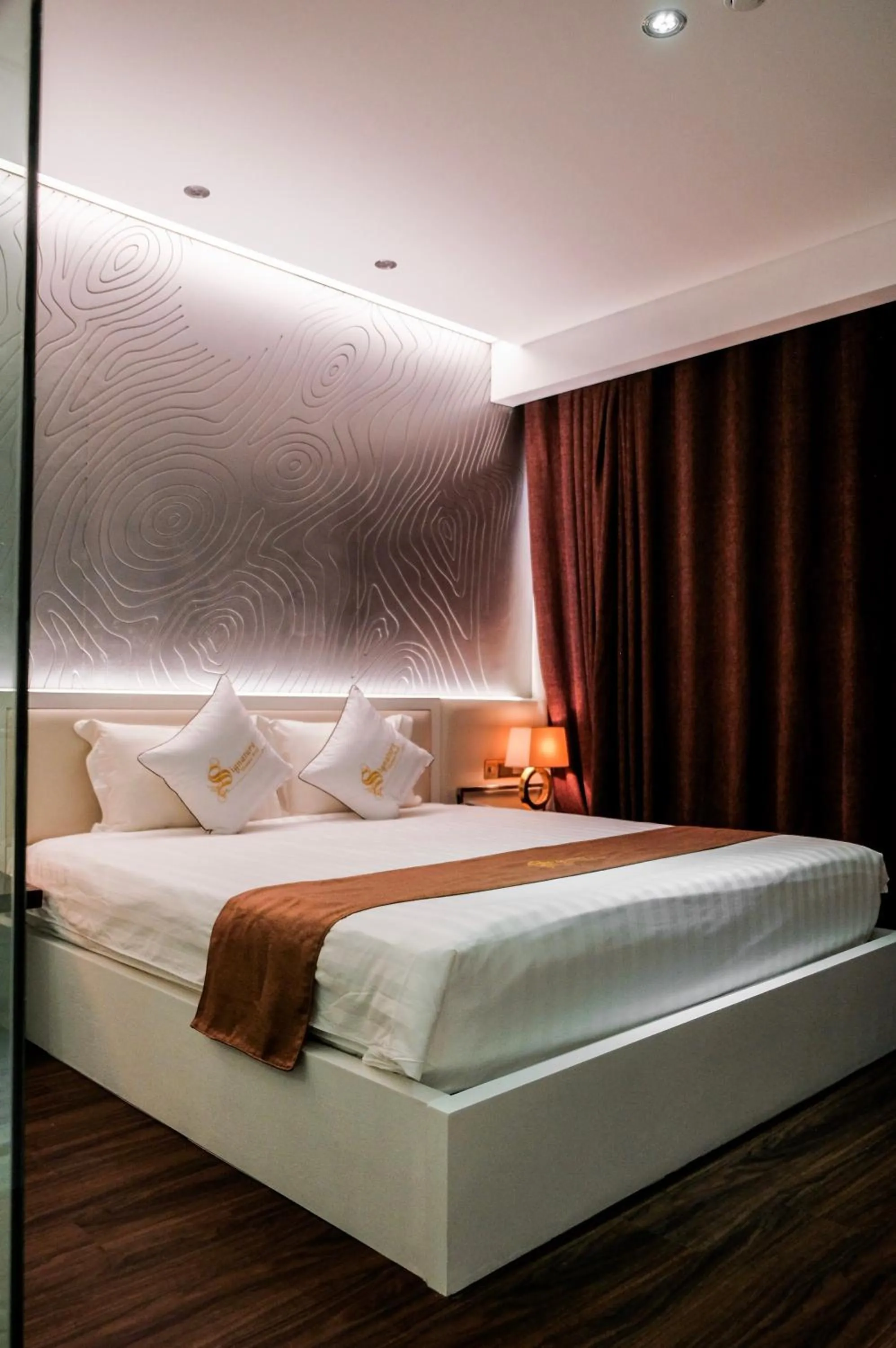 Bed in Signature Boutique Hotel