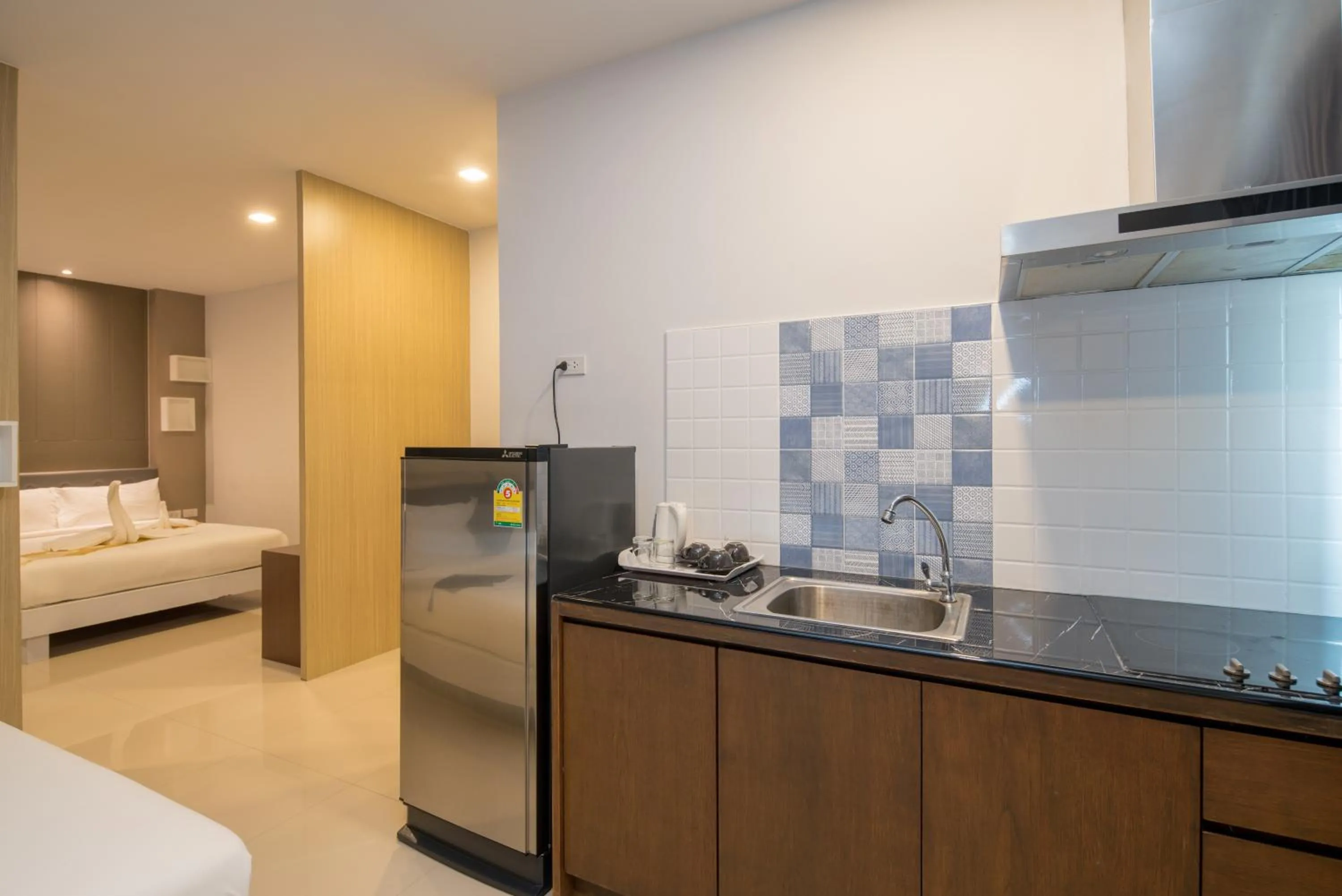 Kitchen or kitchenette, Bed in Baan Thai Beach Side Residence, Patong Beach