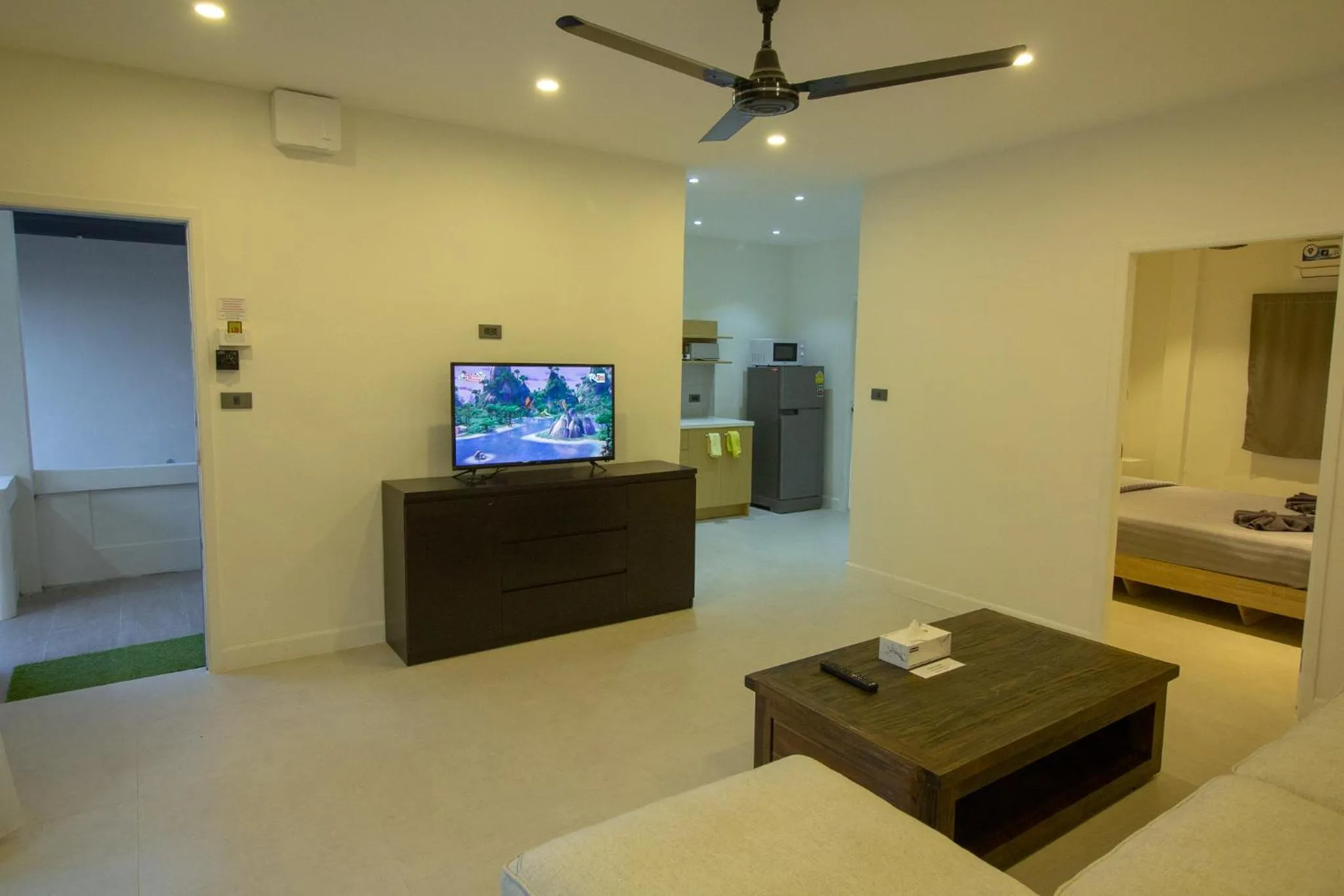 Communal lounge/ TV room, Bed in Aussieland Bungalows