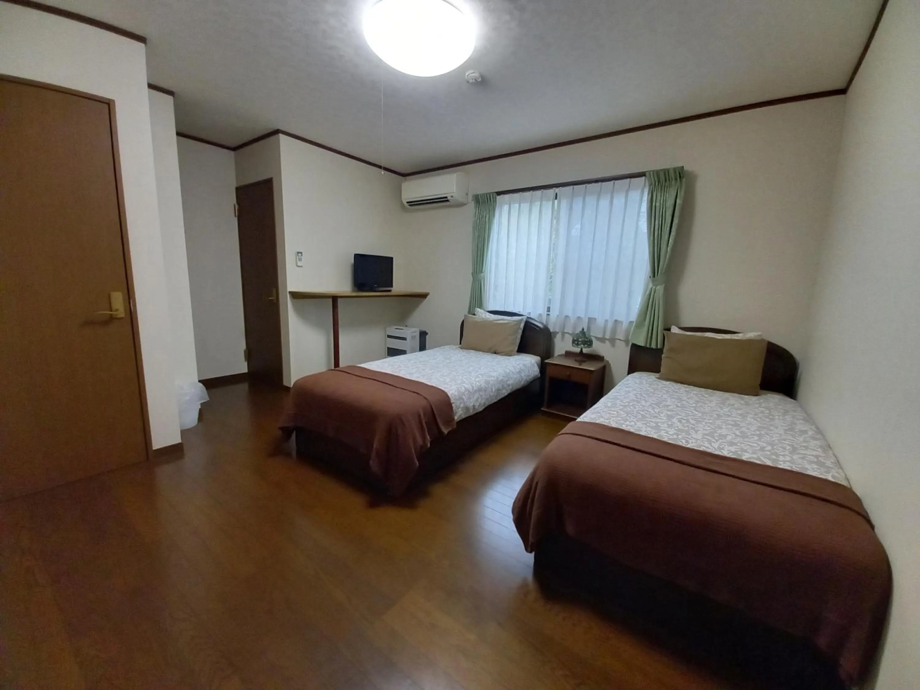 Bed in Hakuba Powder Lodge Taketombo