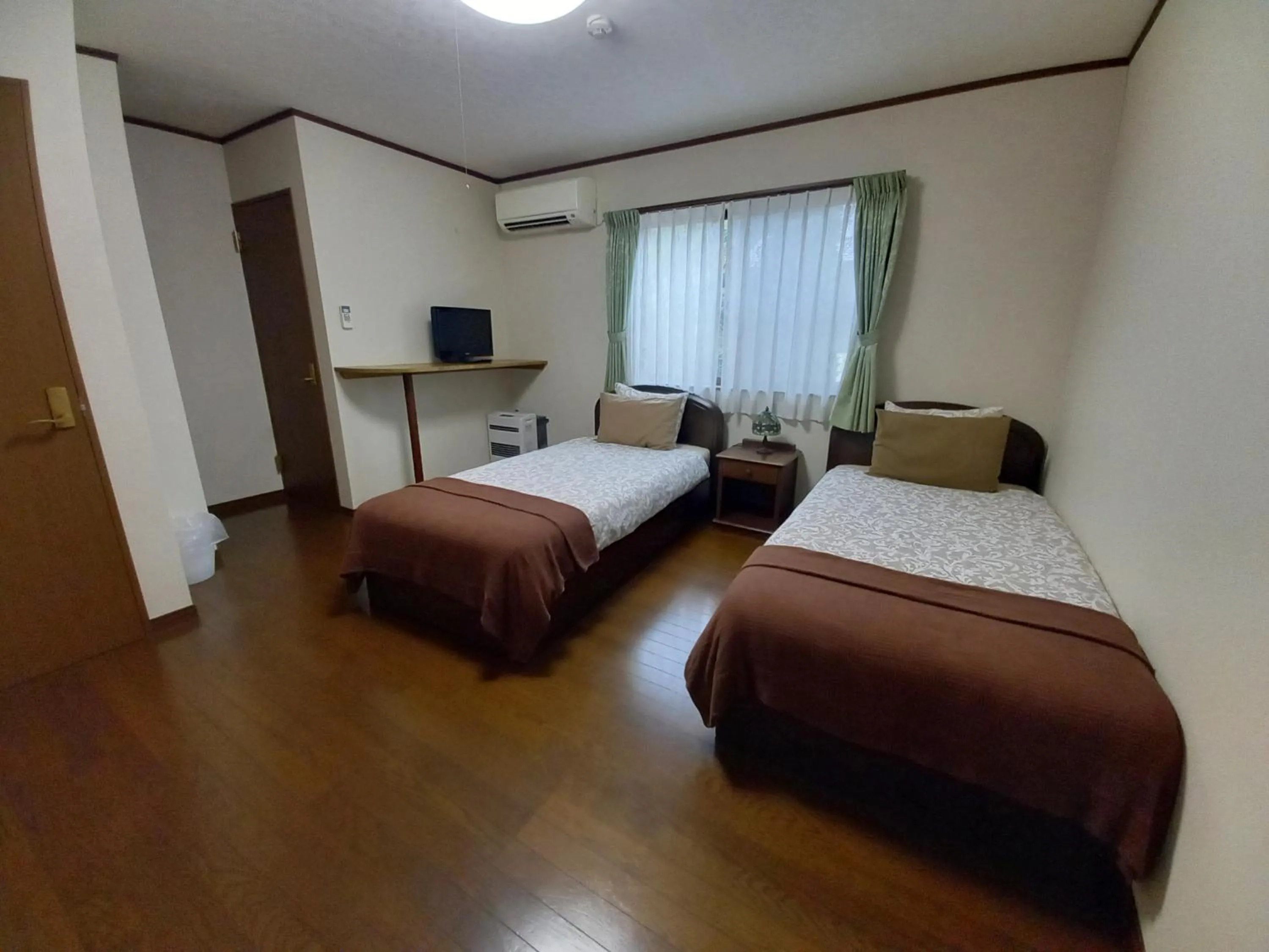 Bed in Hakuba Powder Lodge Taketombo