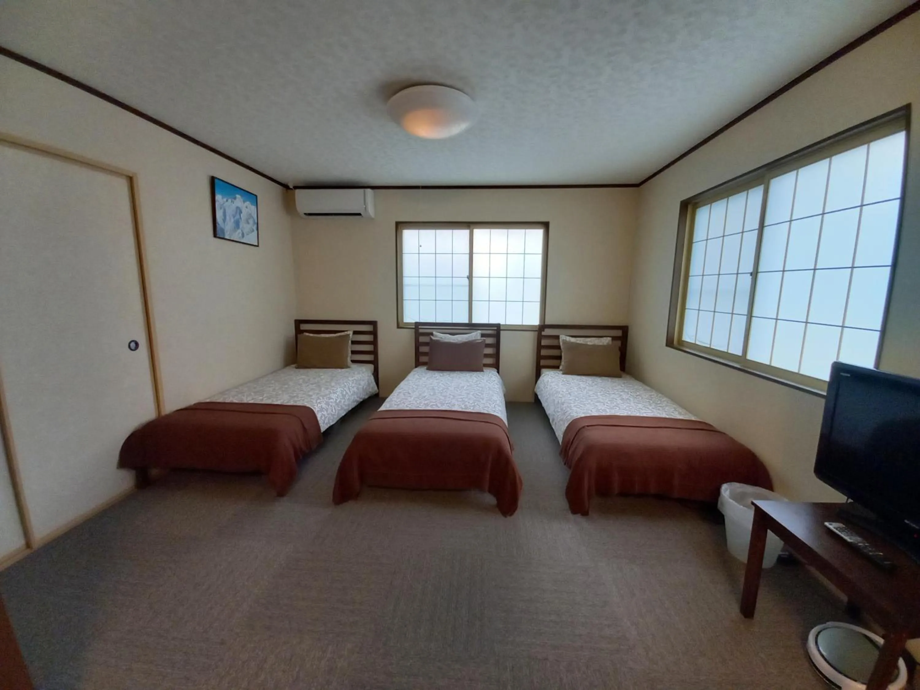 Bed in Hakuba Powder Lodge Taketombo