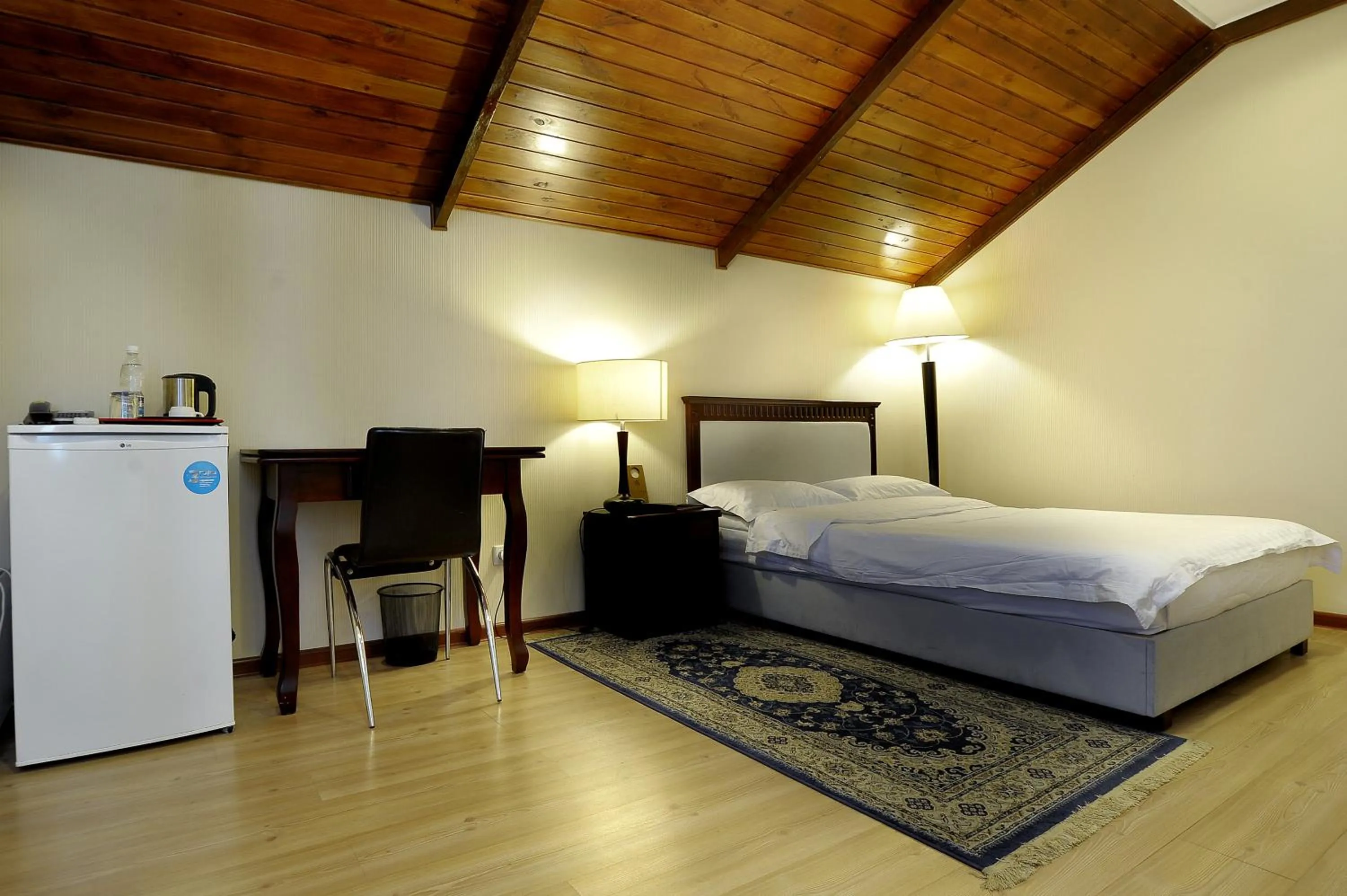 Bed in Tian-Shan Hotel