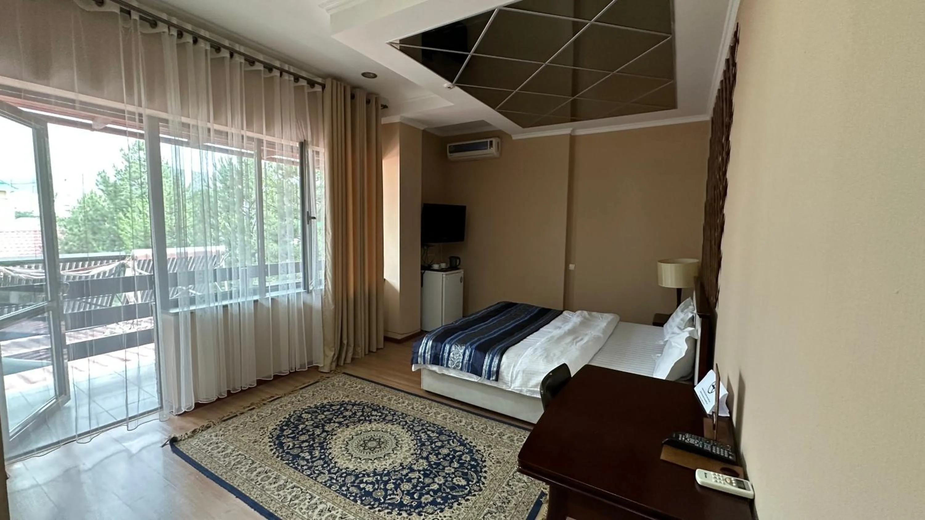 Bed in Tian-Shan Hotel