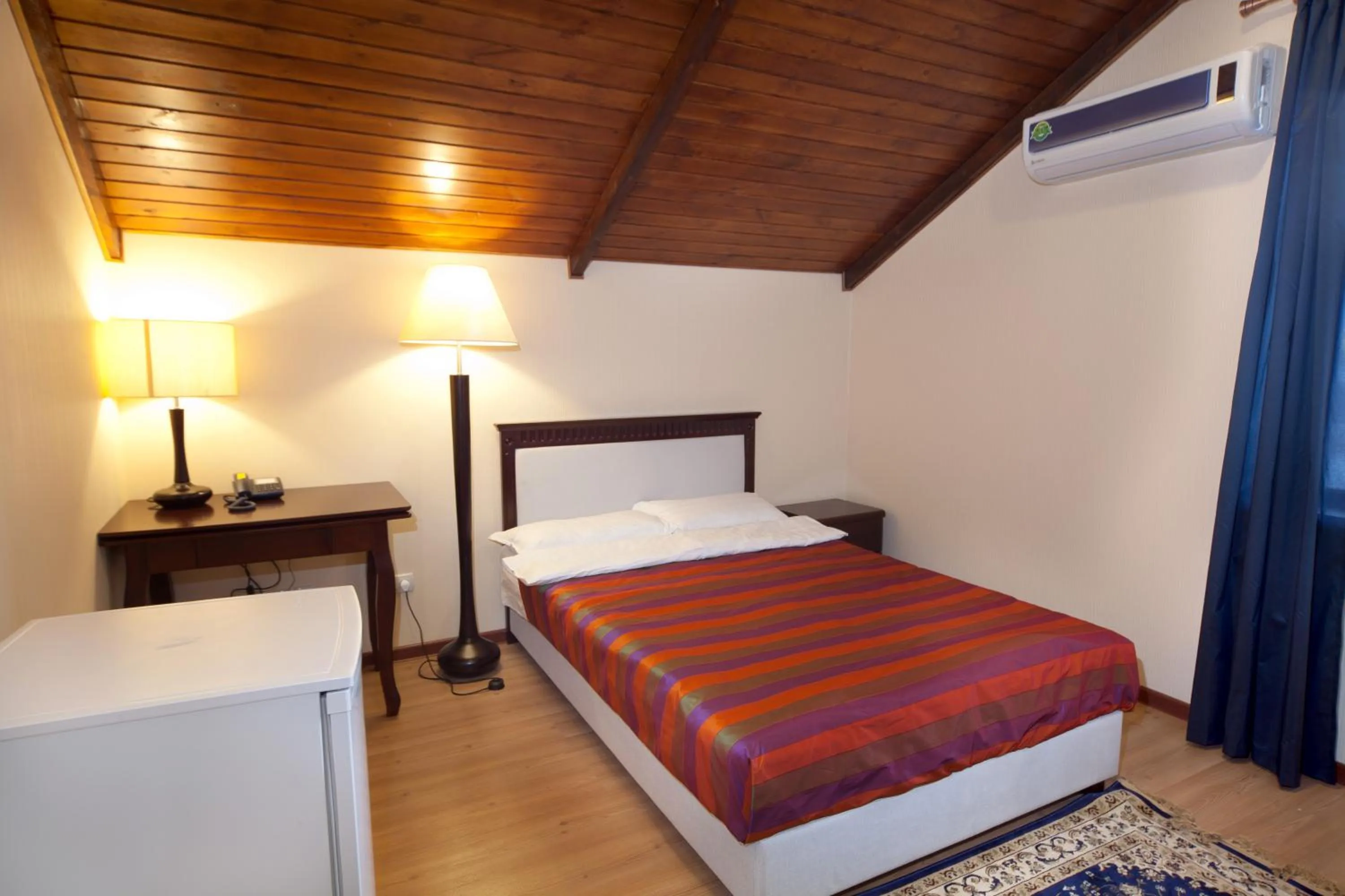 Bed in Tian-Shan Hotel