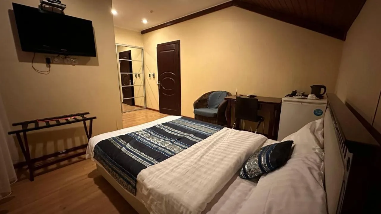 Bed in Tian-Shan Hotel