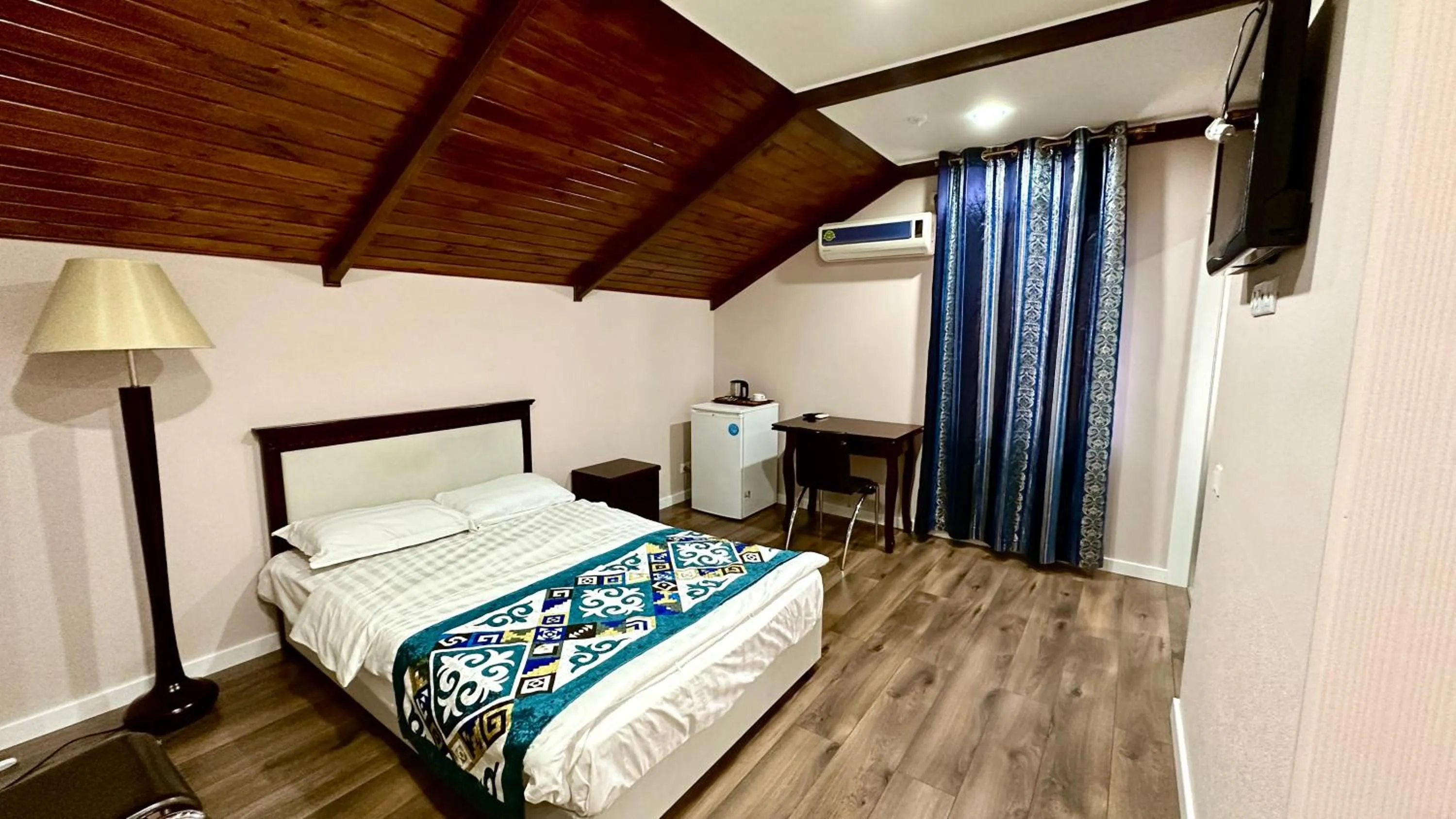 Bed in Tian-Shan Hotel