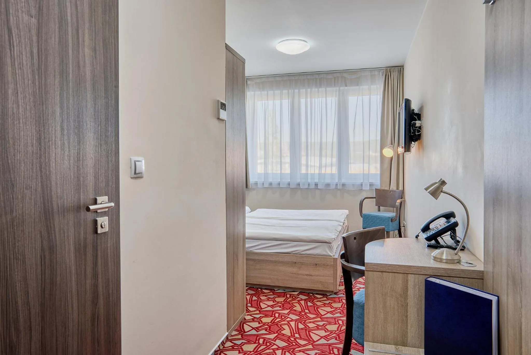 Seating area, Bed in Hotel Arena