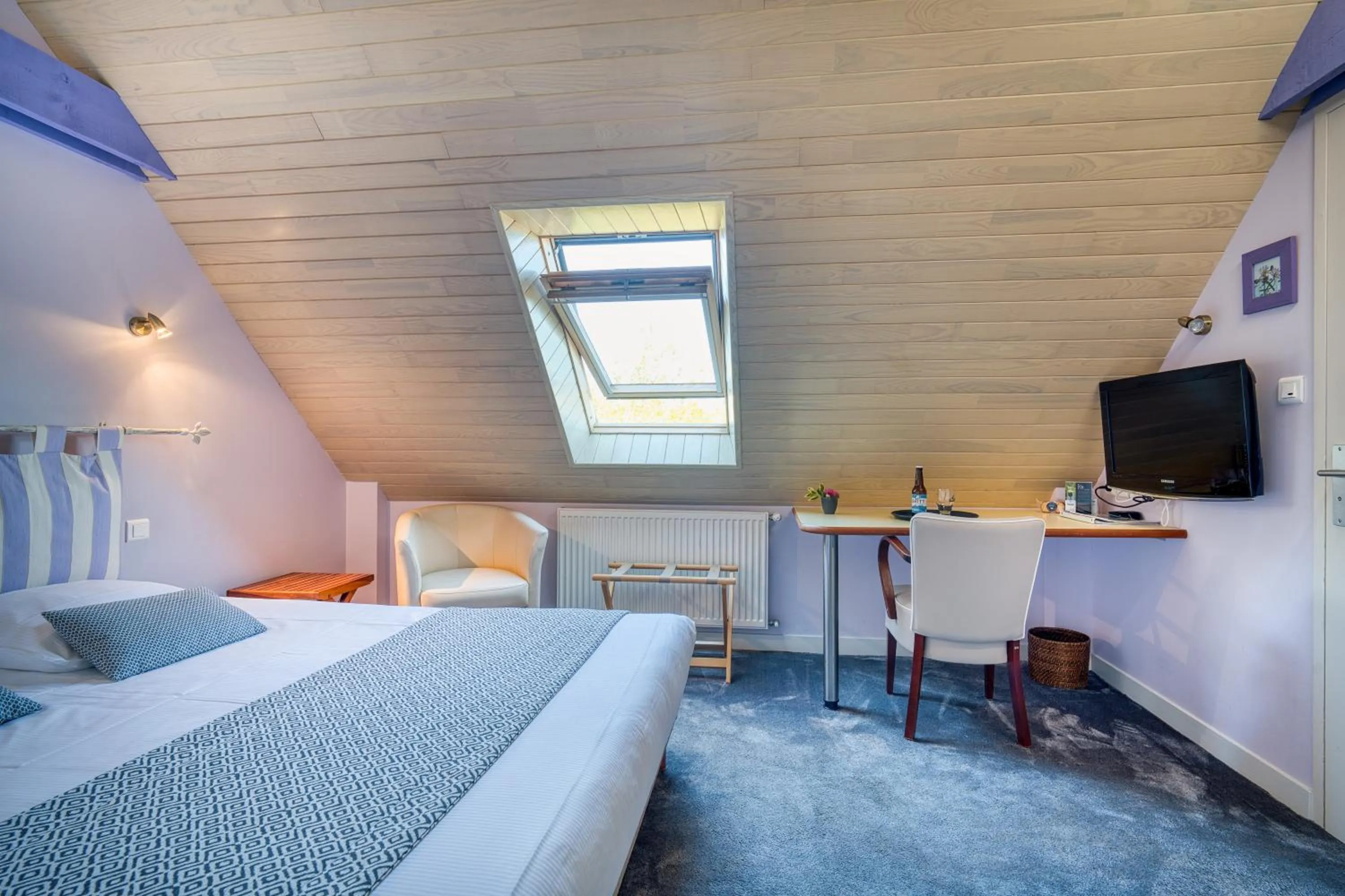 Bed in Logis Hotel Belle-Vue