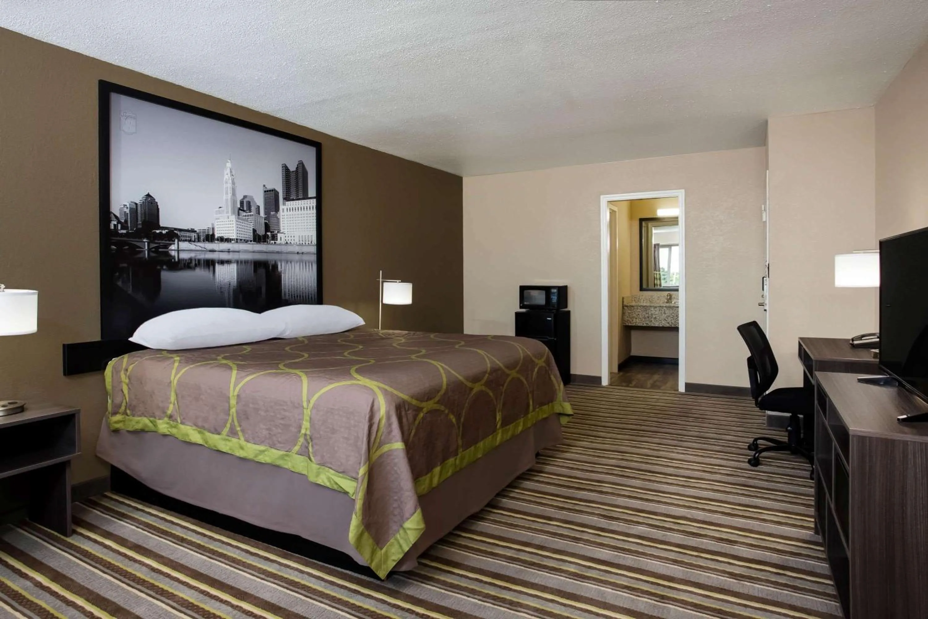 Photo of the whole room, Bed in Travel Inn Of Sidney Ohio