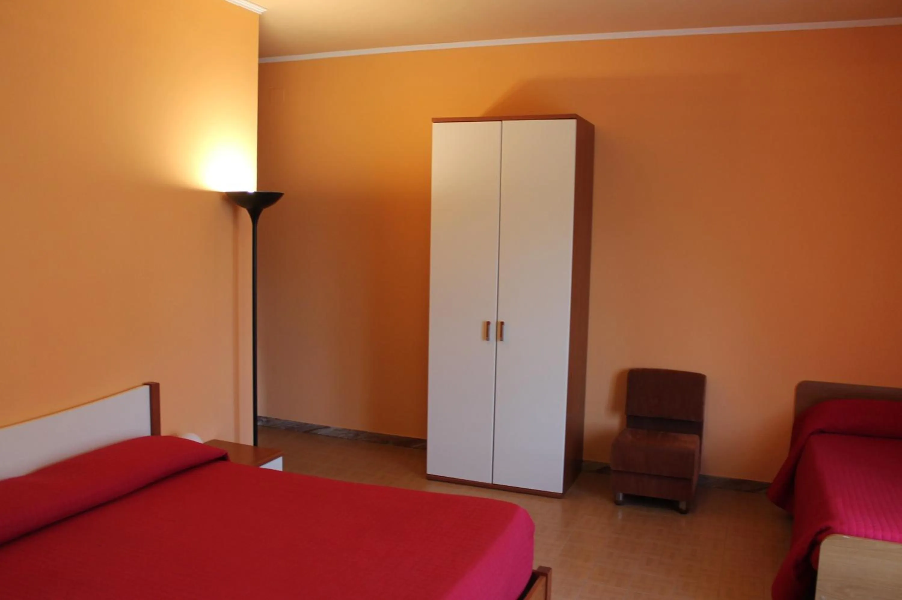 Bed in Albergo Paradiso