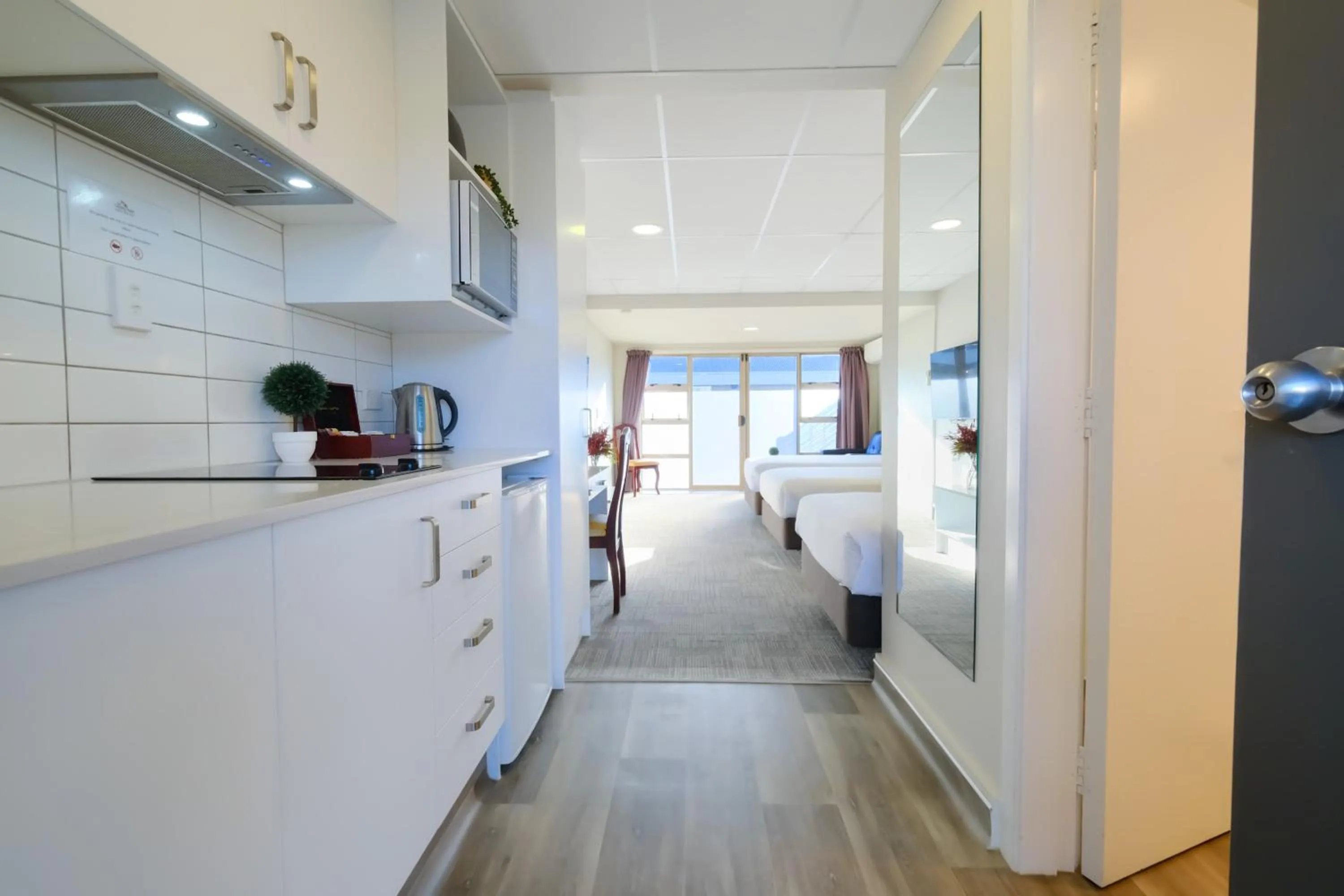 Kitchen or kitchenette, Bed in The Garden Hotel