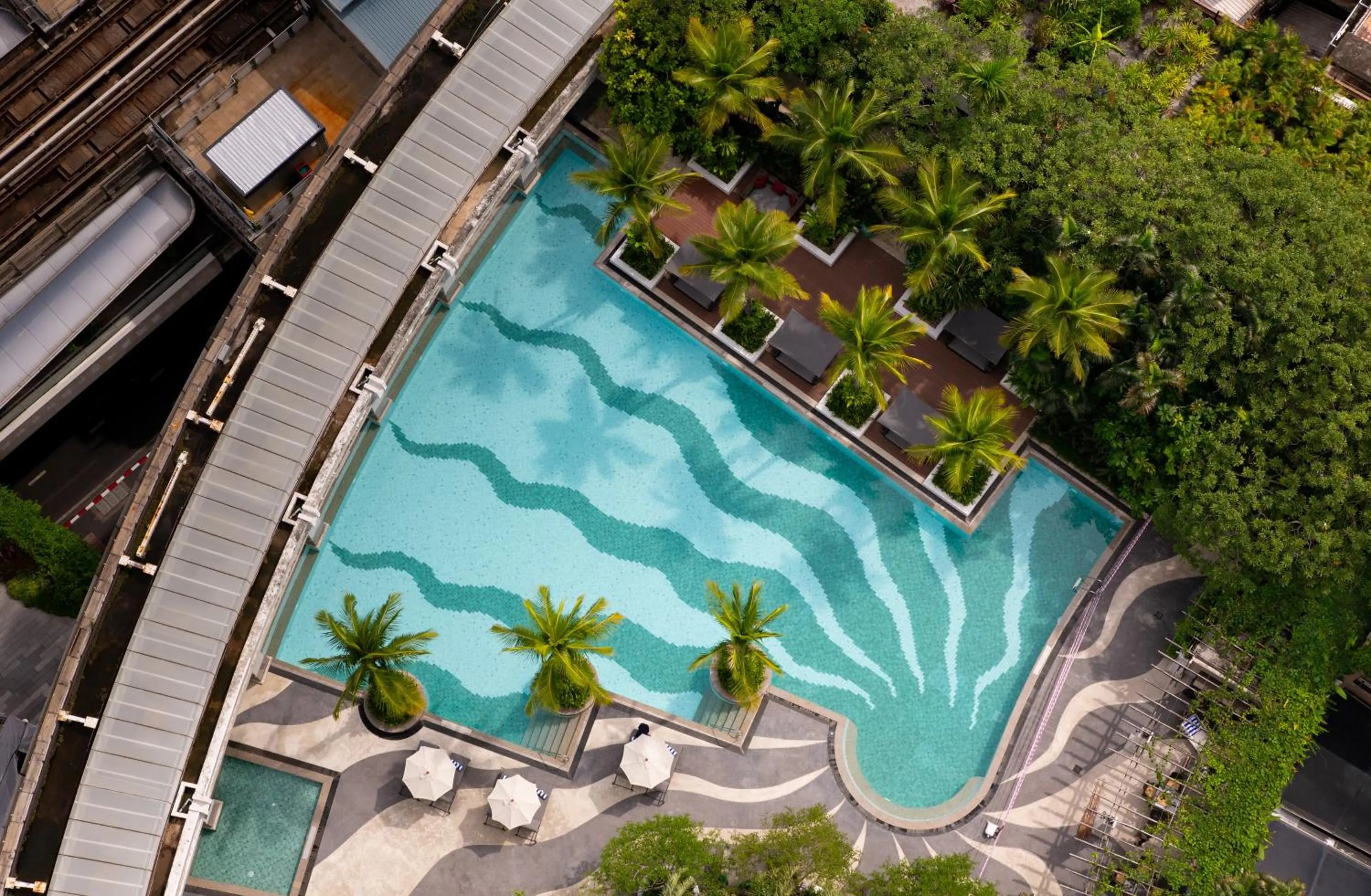Swimming pool in Emporium Suites by Chatrium