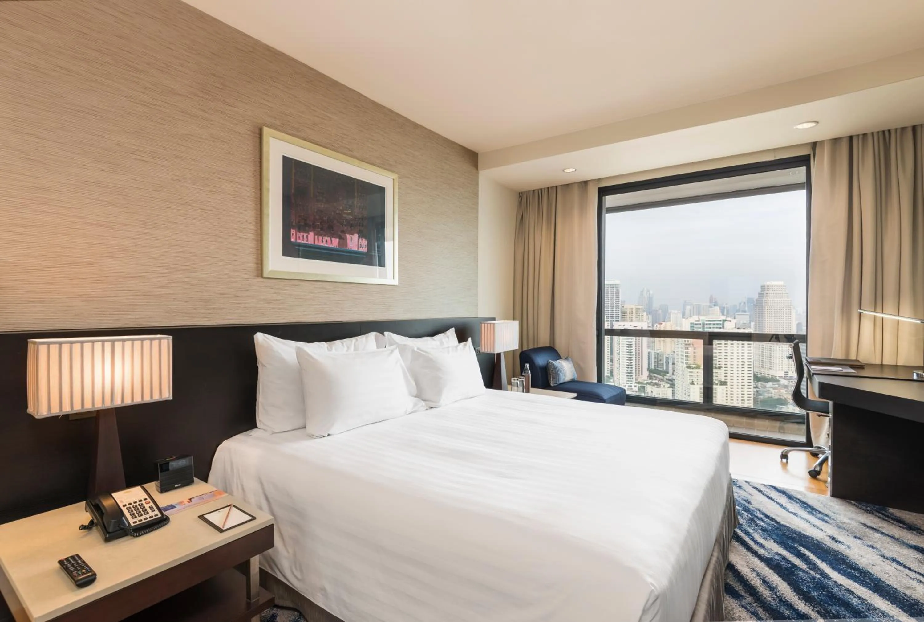 Bed in Emporium Suites by Chatrium