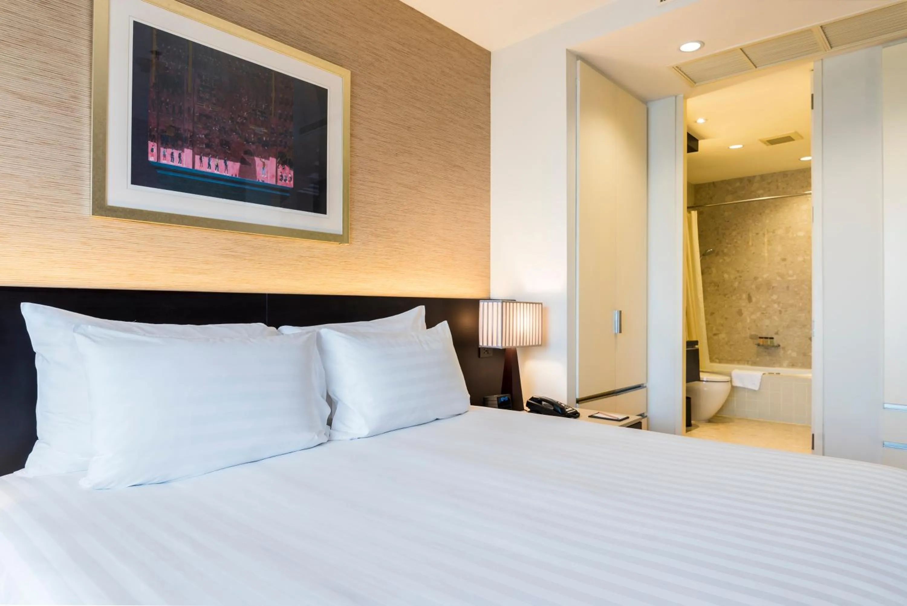 Bed in Emporium Suites by Chatrium