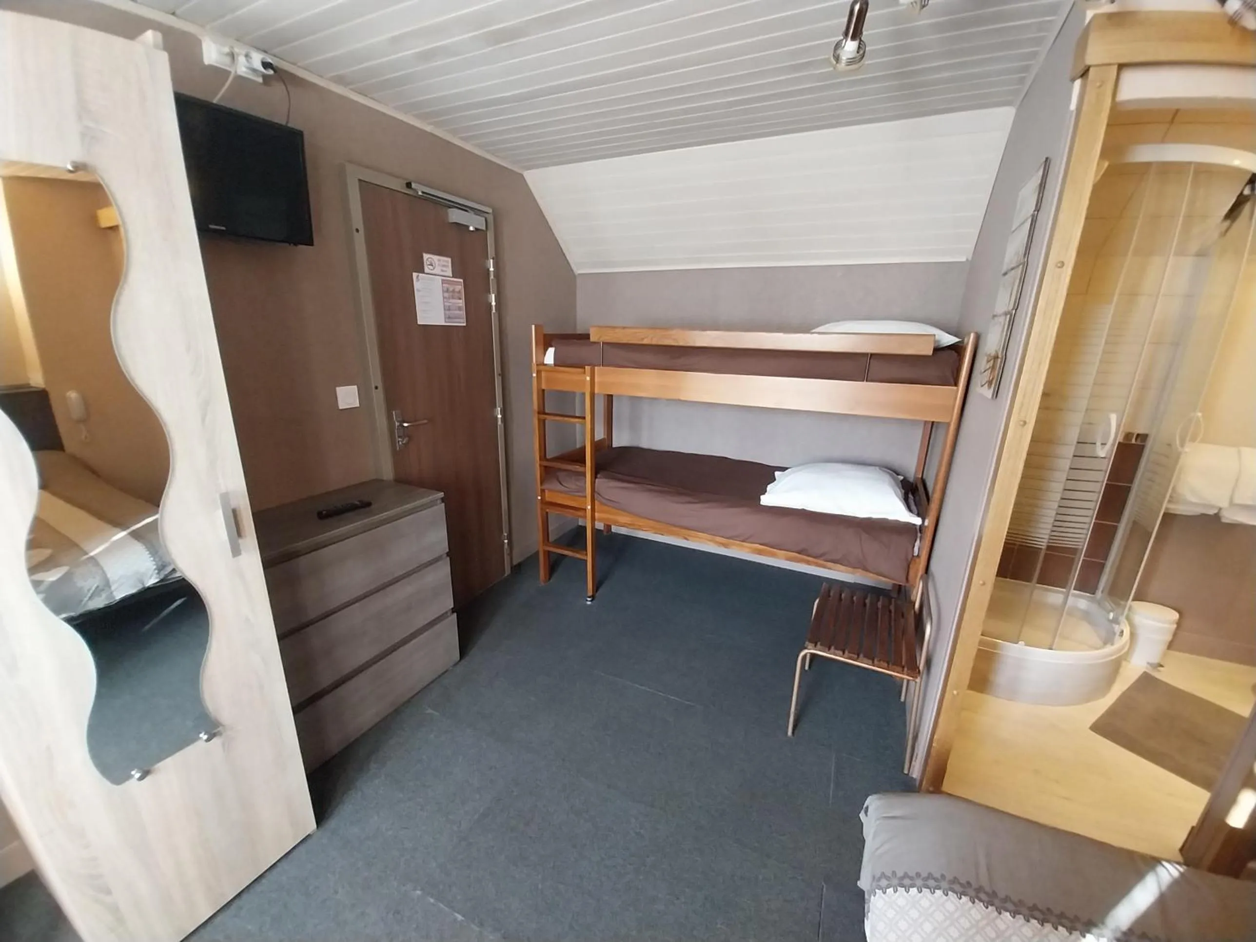 Shower, Bed in Hôtel les Deux Cols