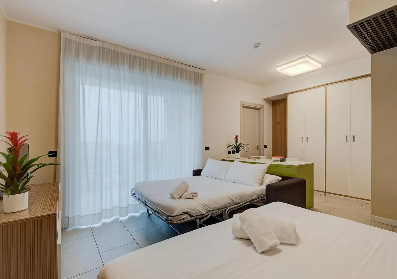 Communal lounge/ TV room, Bed in Camplus Turro Casa per Ferie