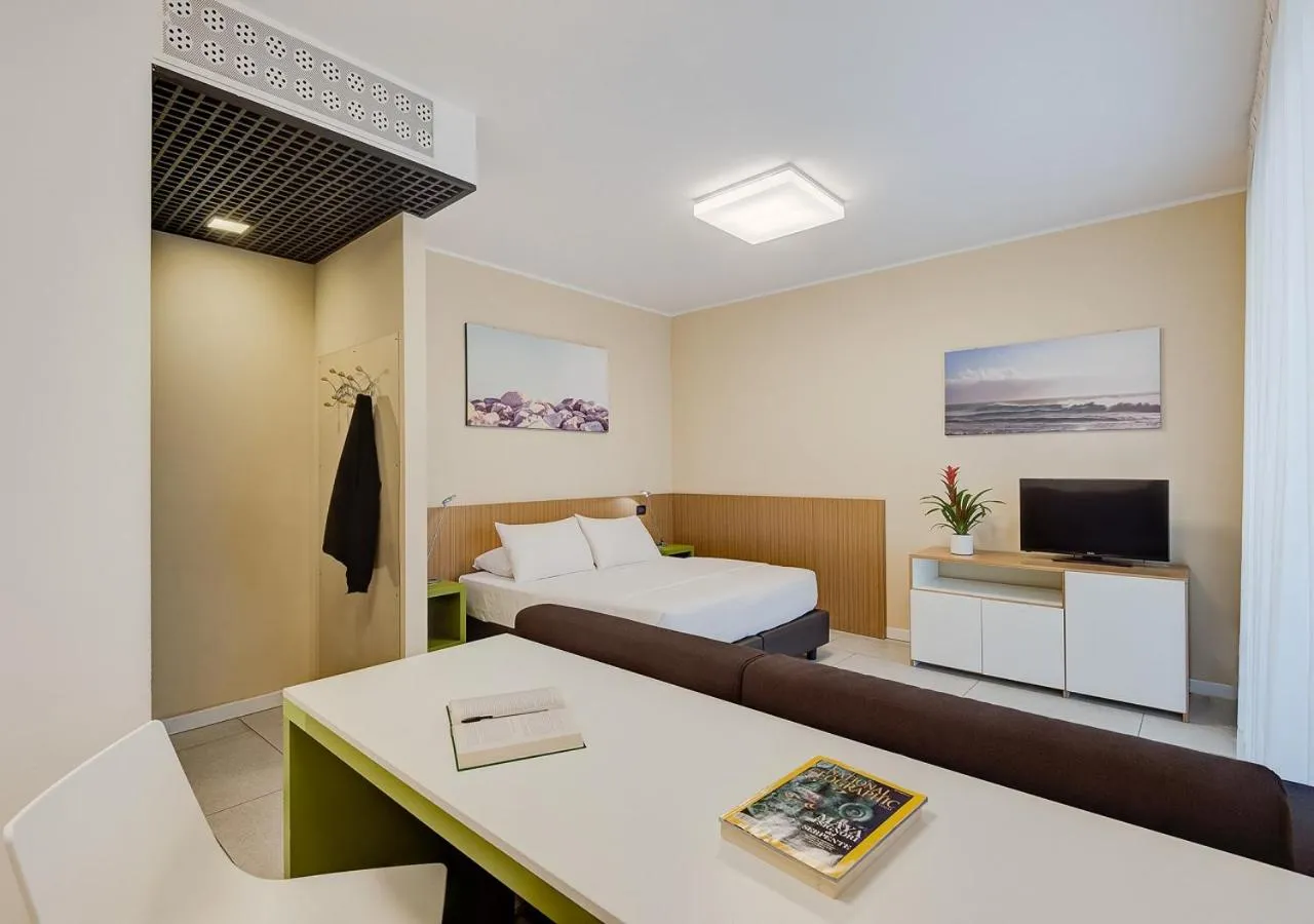 Communal lounge/ TV room, Bed in Camplus Turro Casa per Ferie