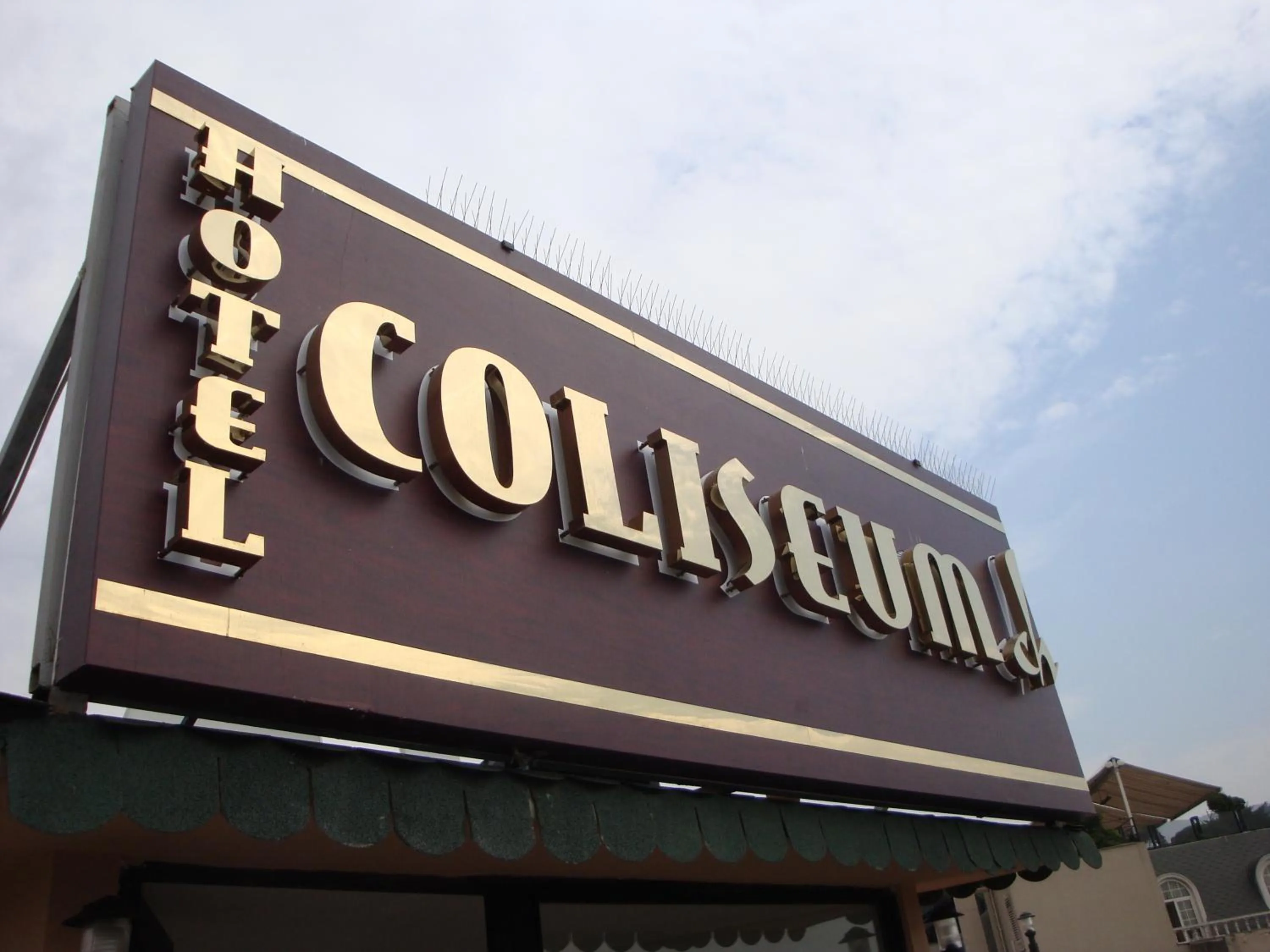 Property logo or sign in Hotel Coliseum