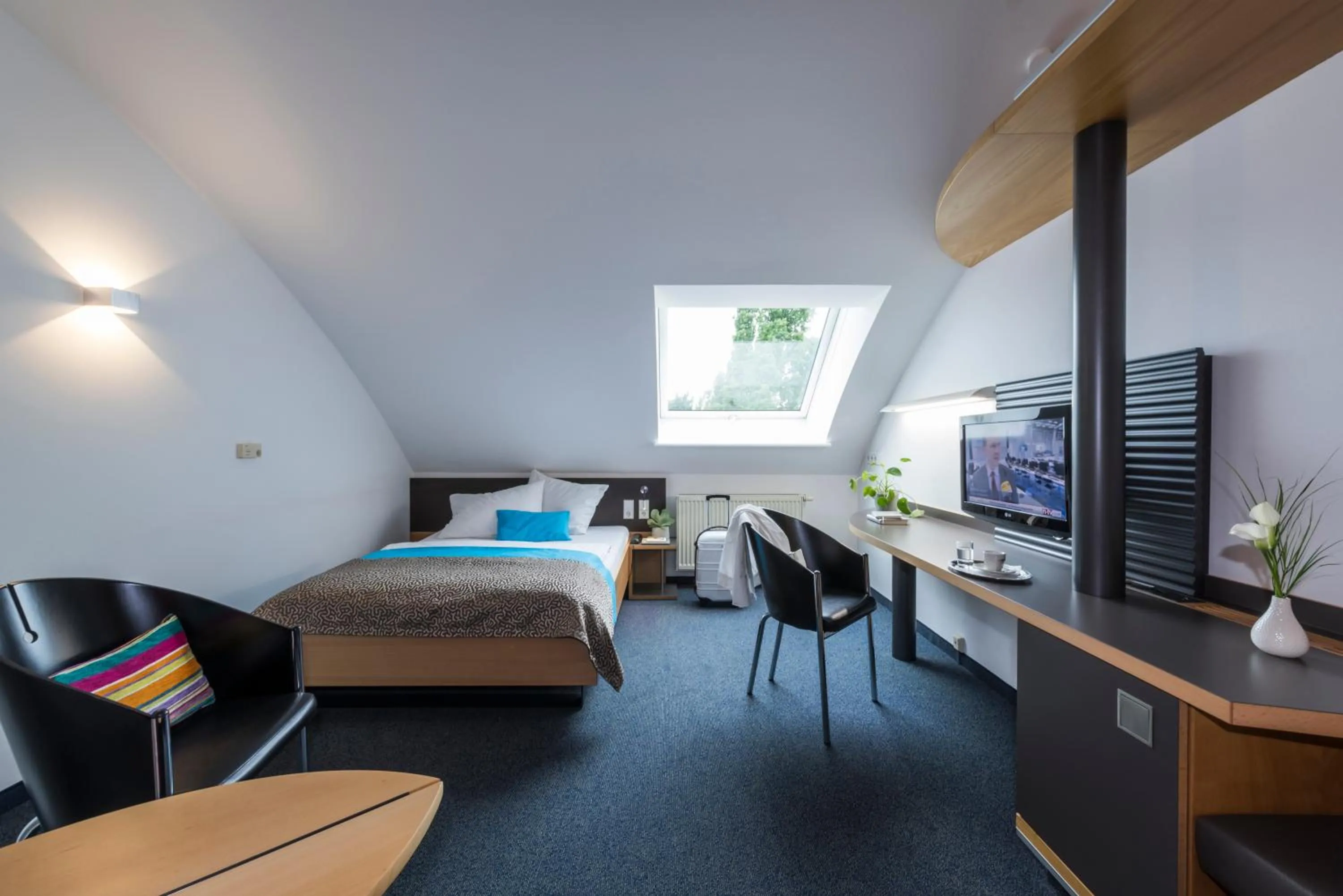 Photo of the whole room, Bed in SEEhotel Friedrichshafen