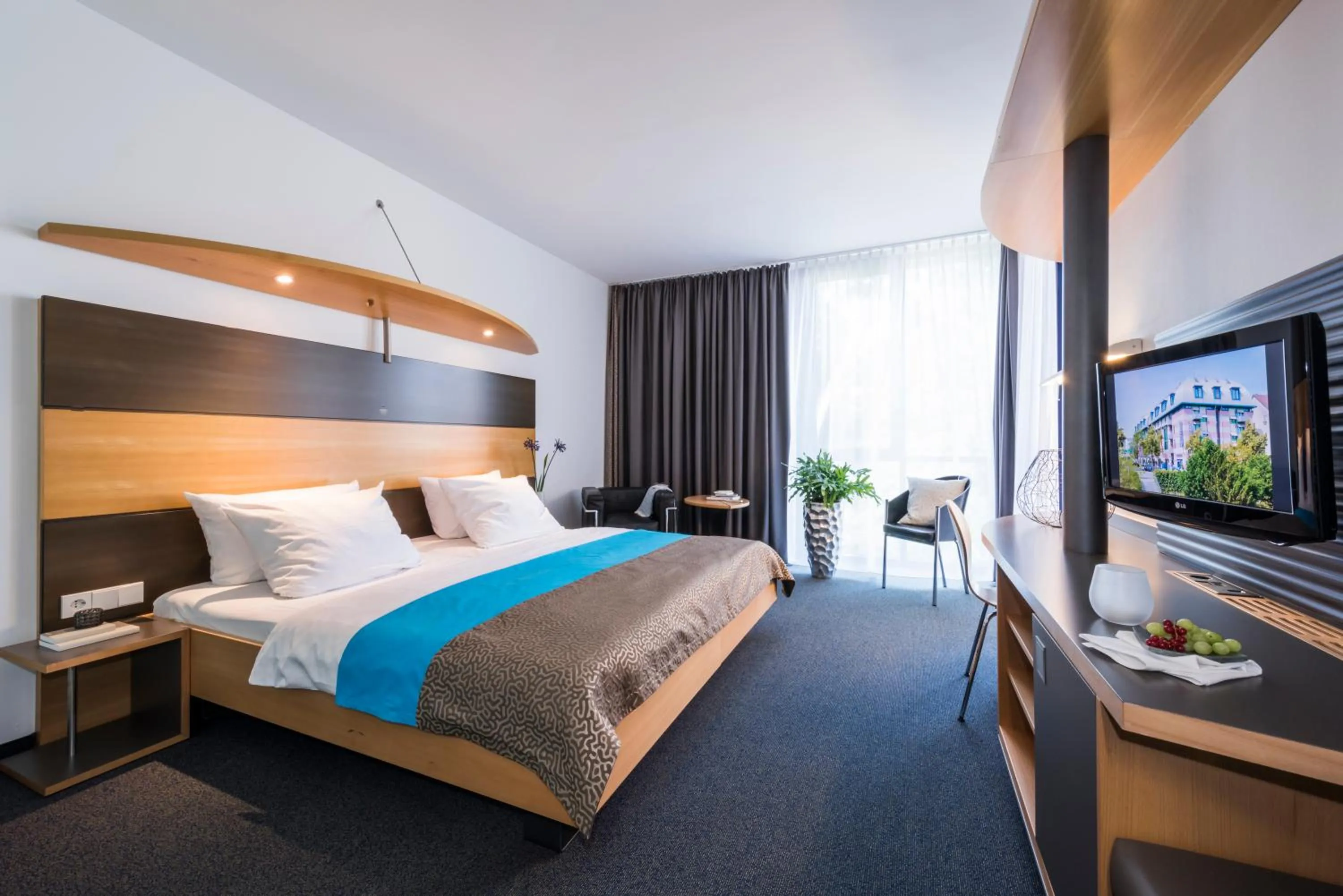 Photo of the whole room, Bed in SEEhotel Friedrichshafen