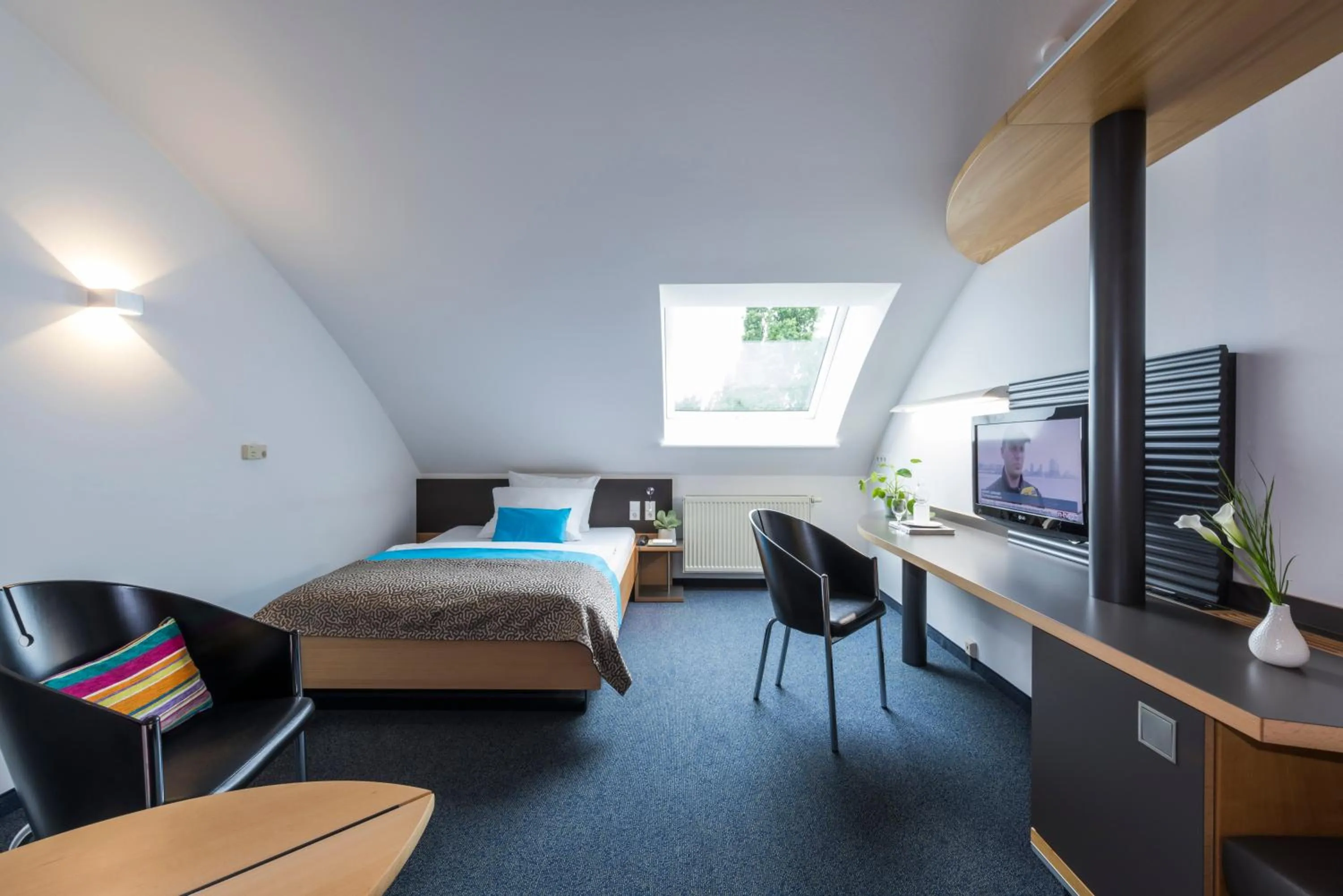 Photo of the whole room, Bed in SEEhotel Friedrichshafen