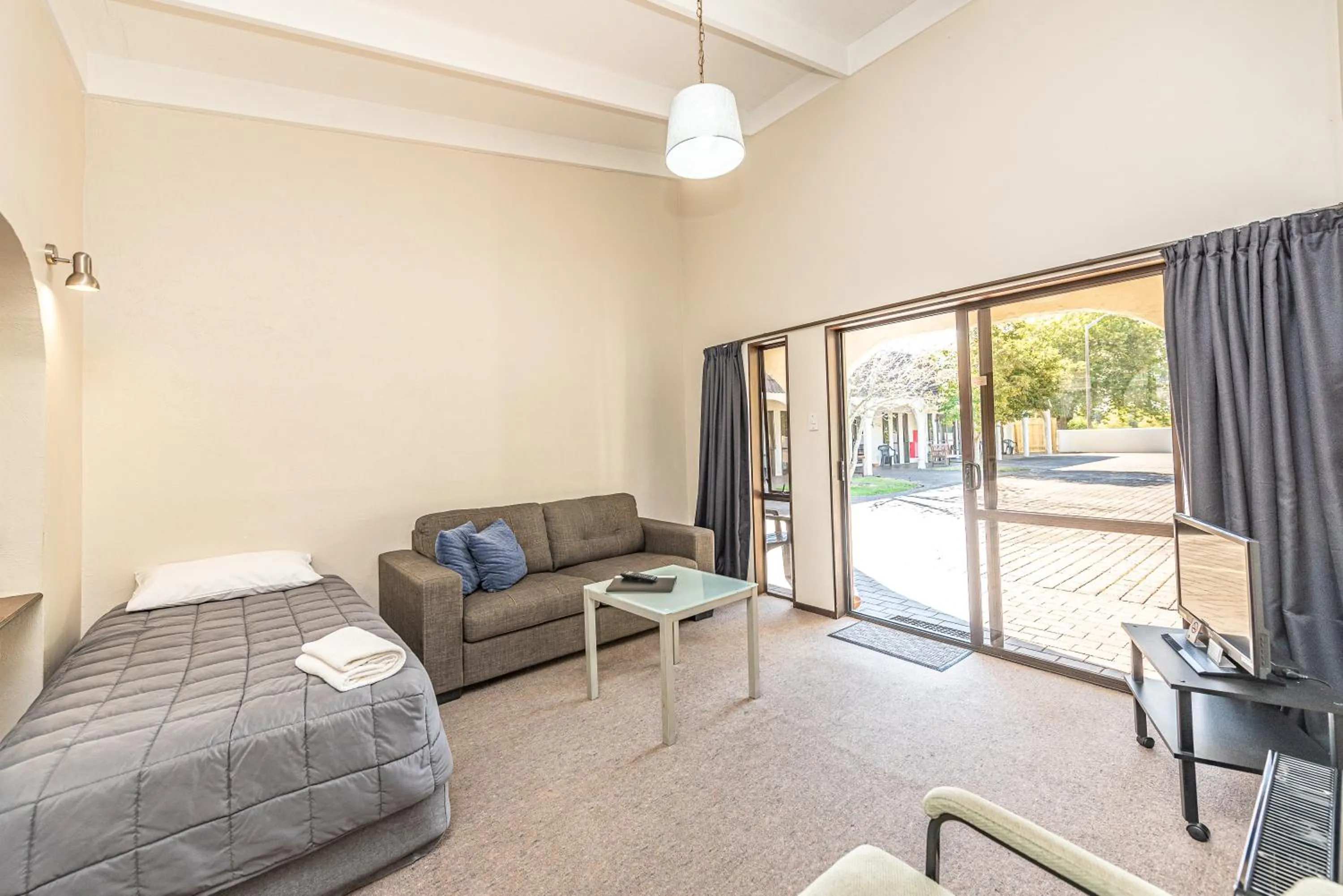 Bed in Riverside Motel