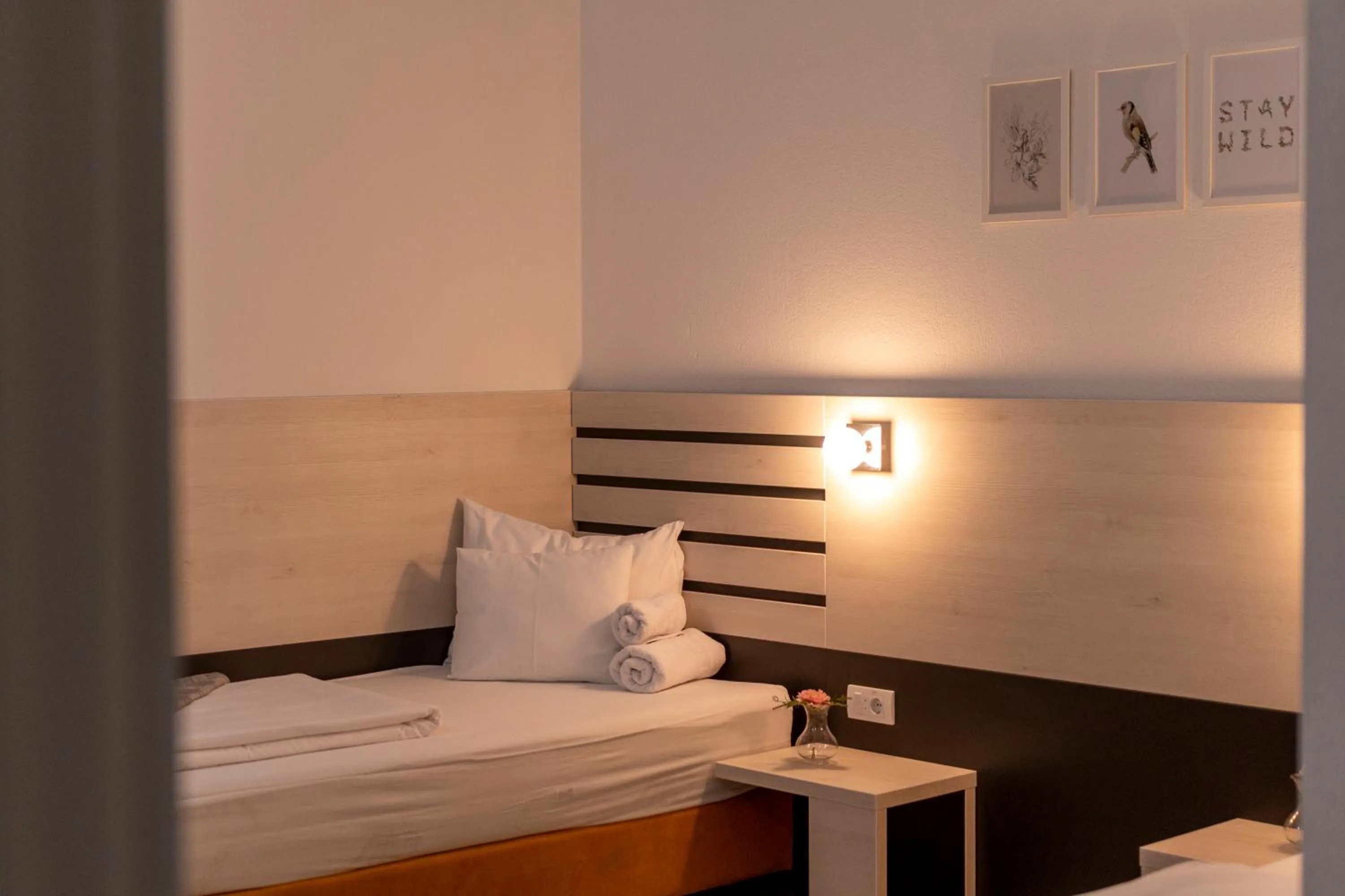 Bed in Garni Hotel 11tica DM