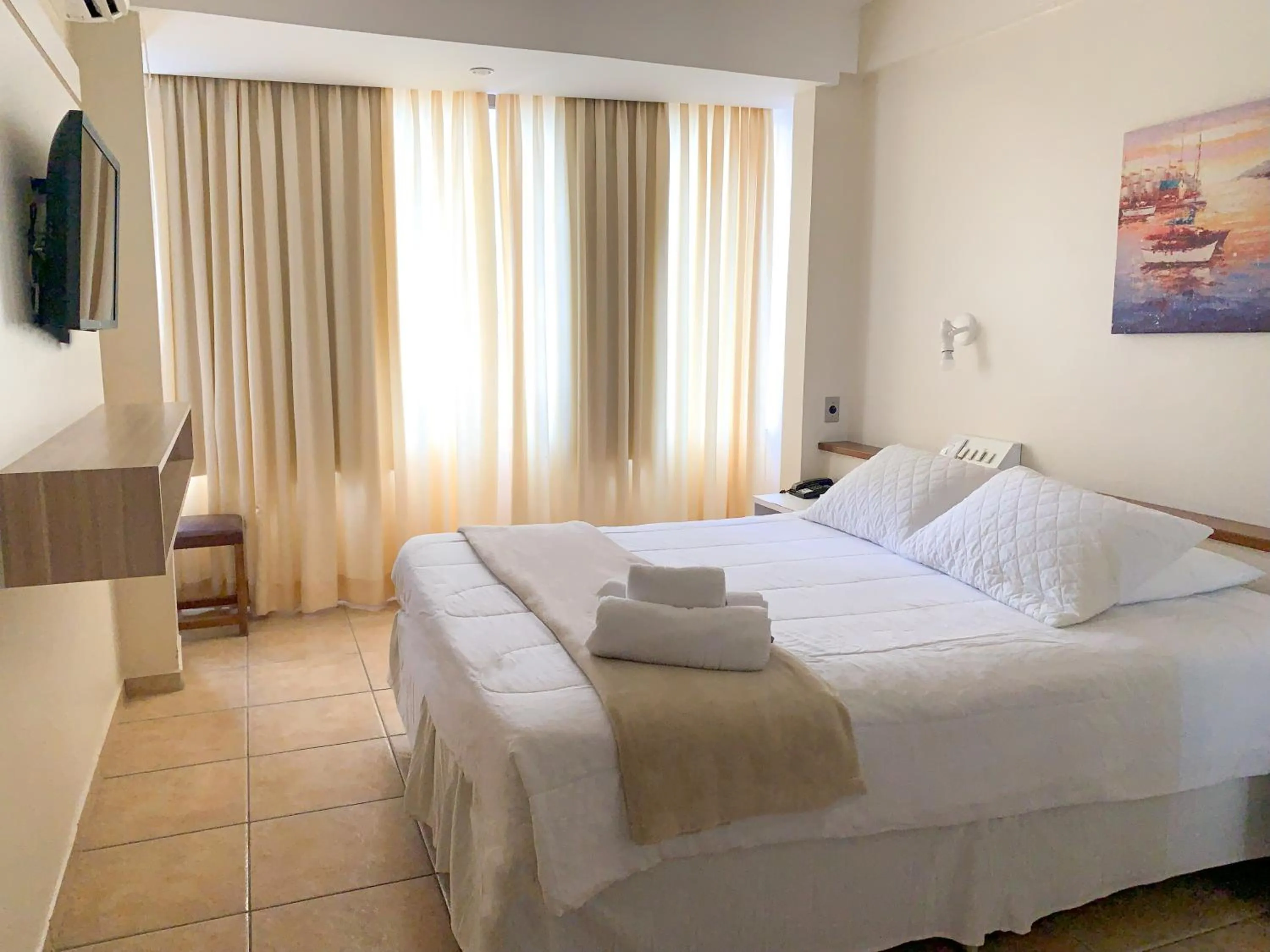 Bed in De Rose Palace Hotel