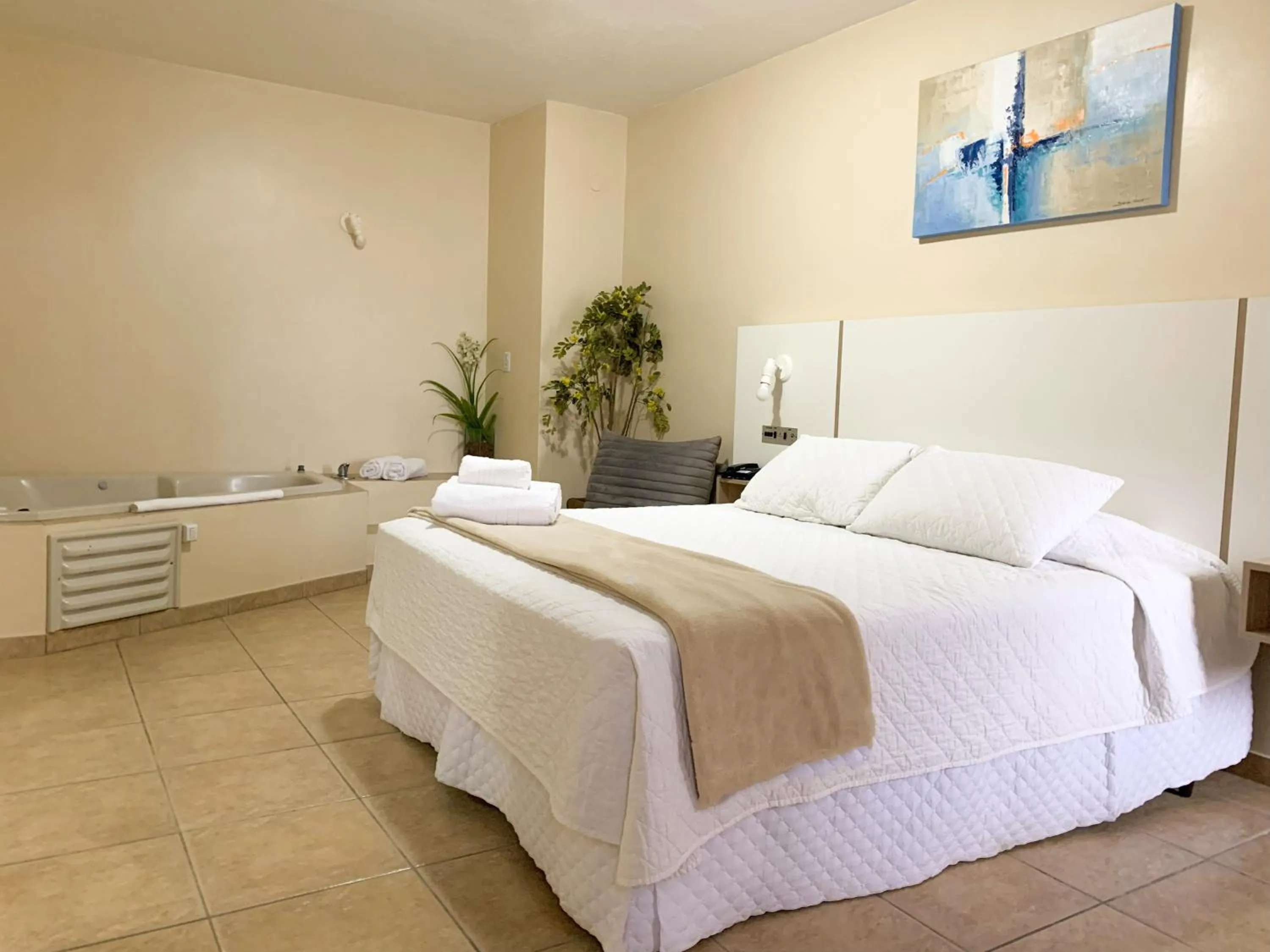 Bed in De Rose Palace Hotel