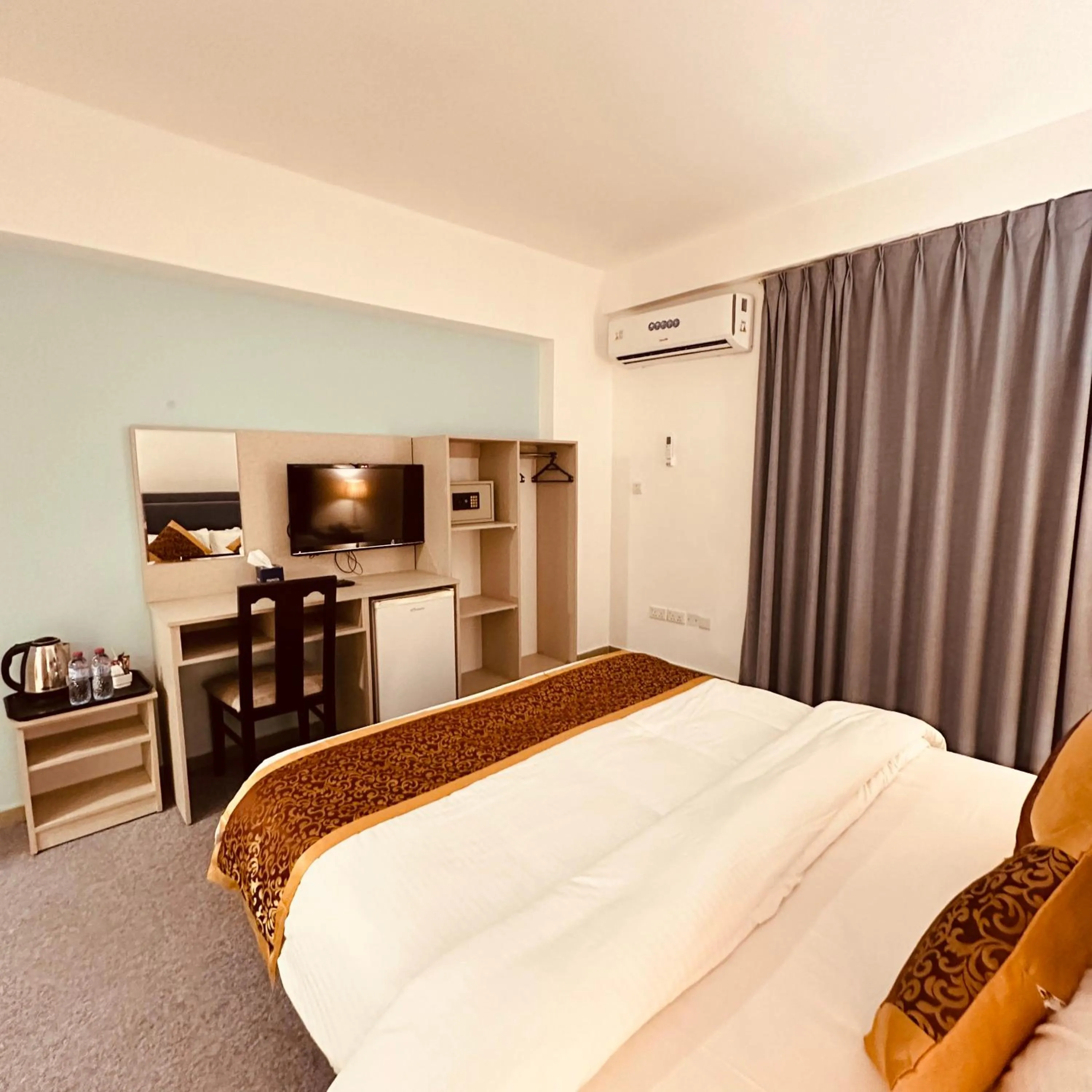 Bed in Aquavista Hotel & Suites