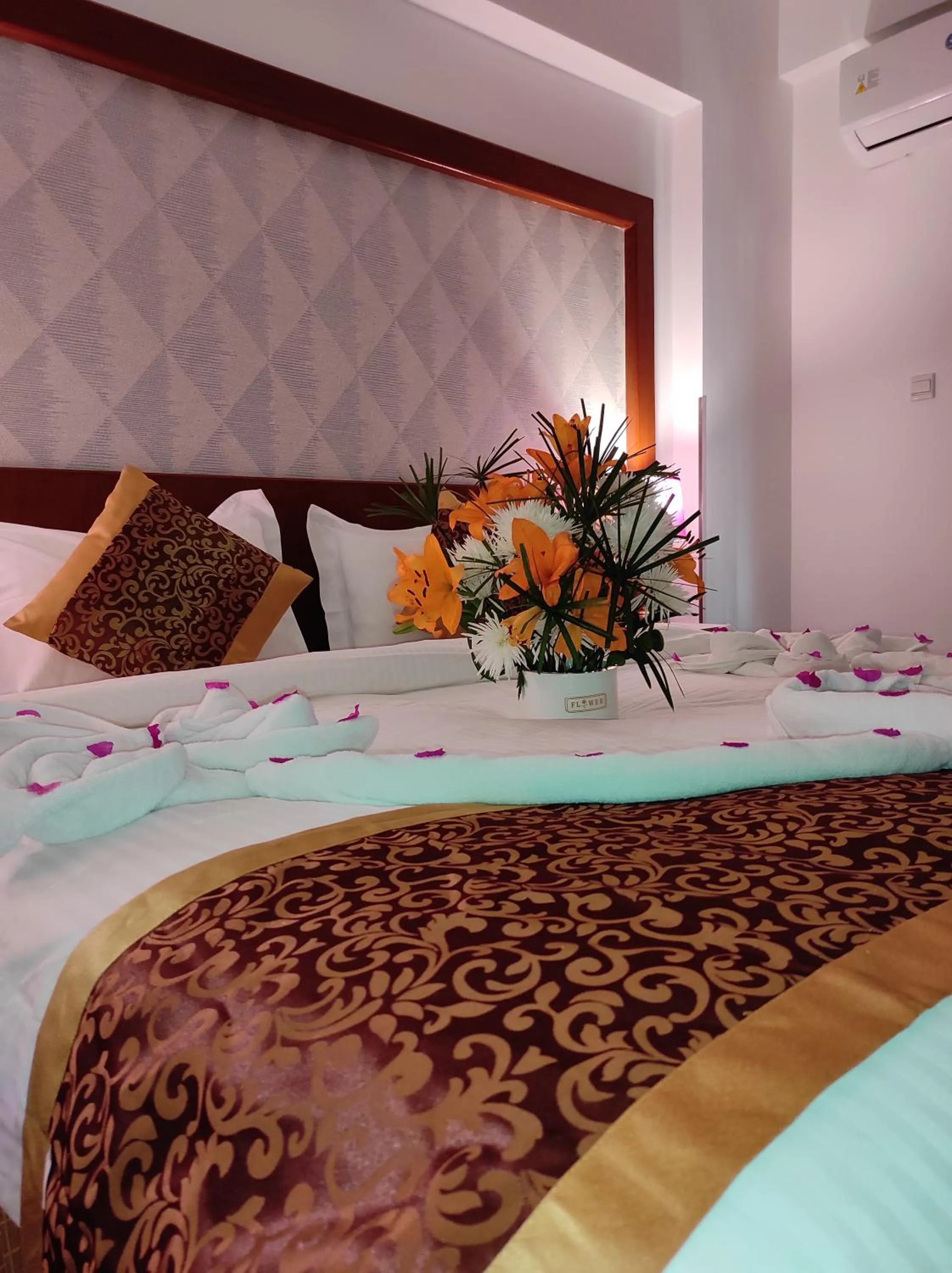 Bed in Aquavista Hotel & Suites
