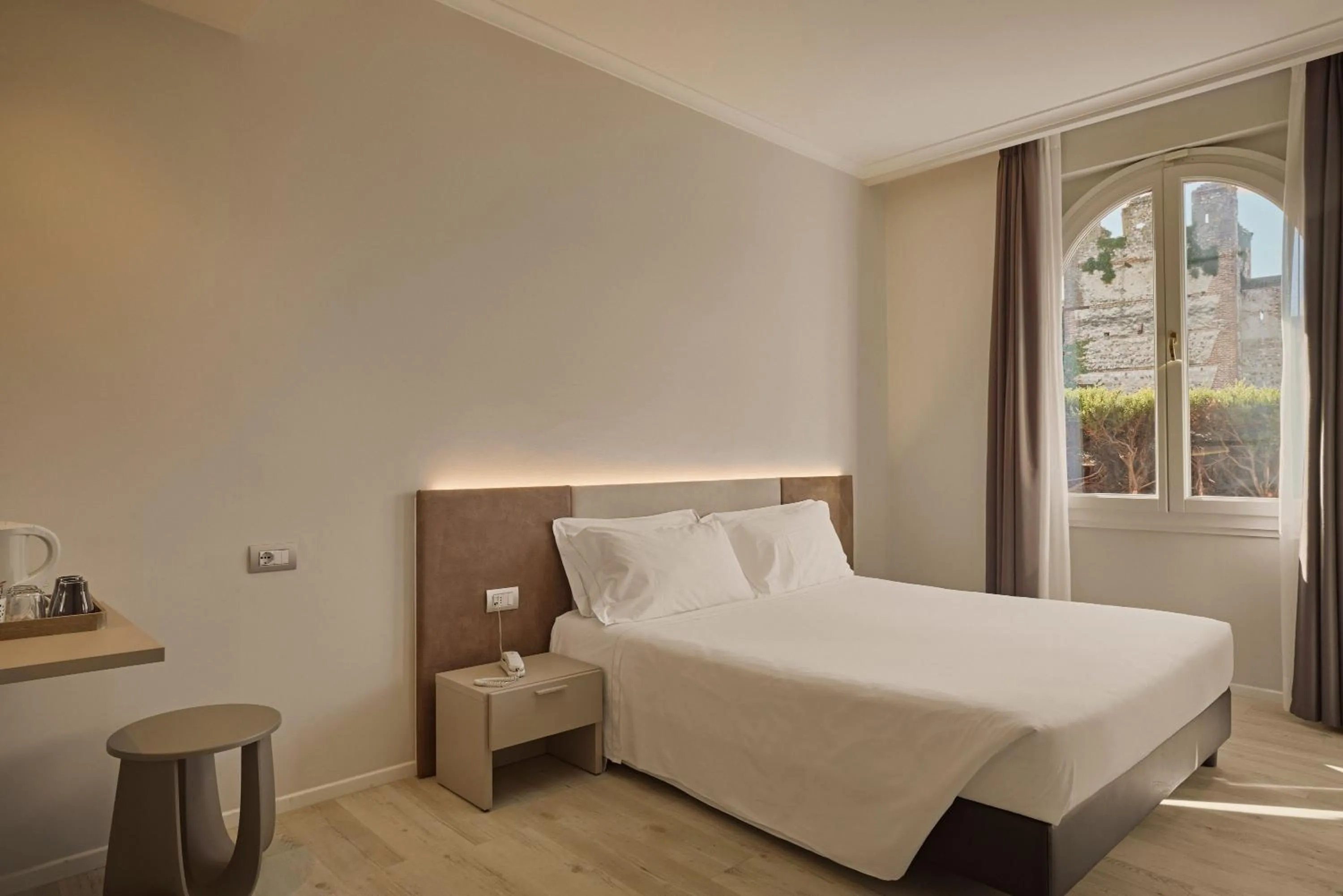 Bed in Hotel Le Mura