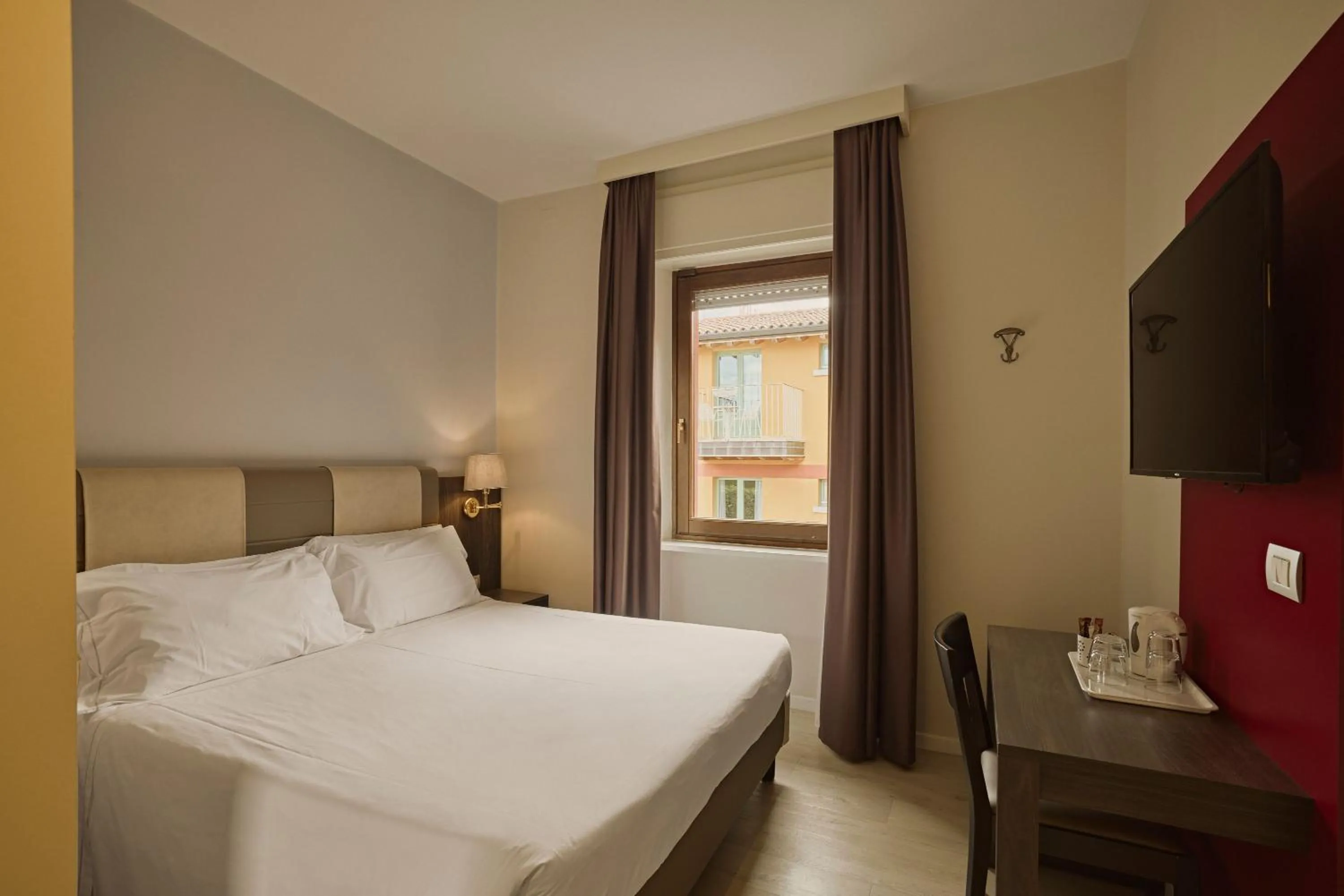 Bed in Hotel Le Mura