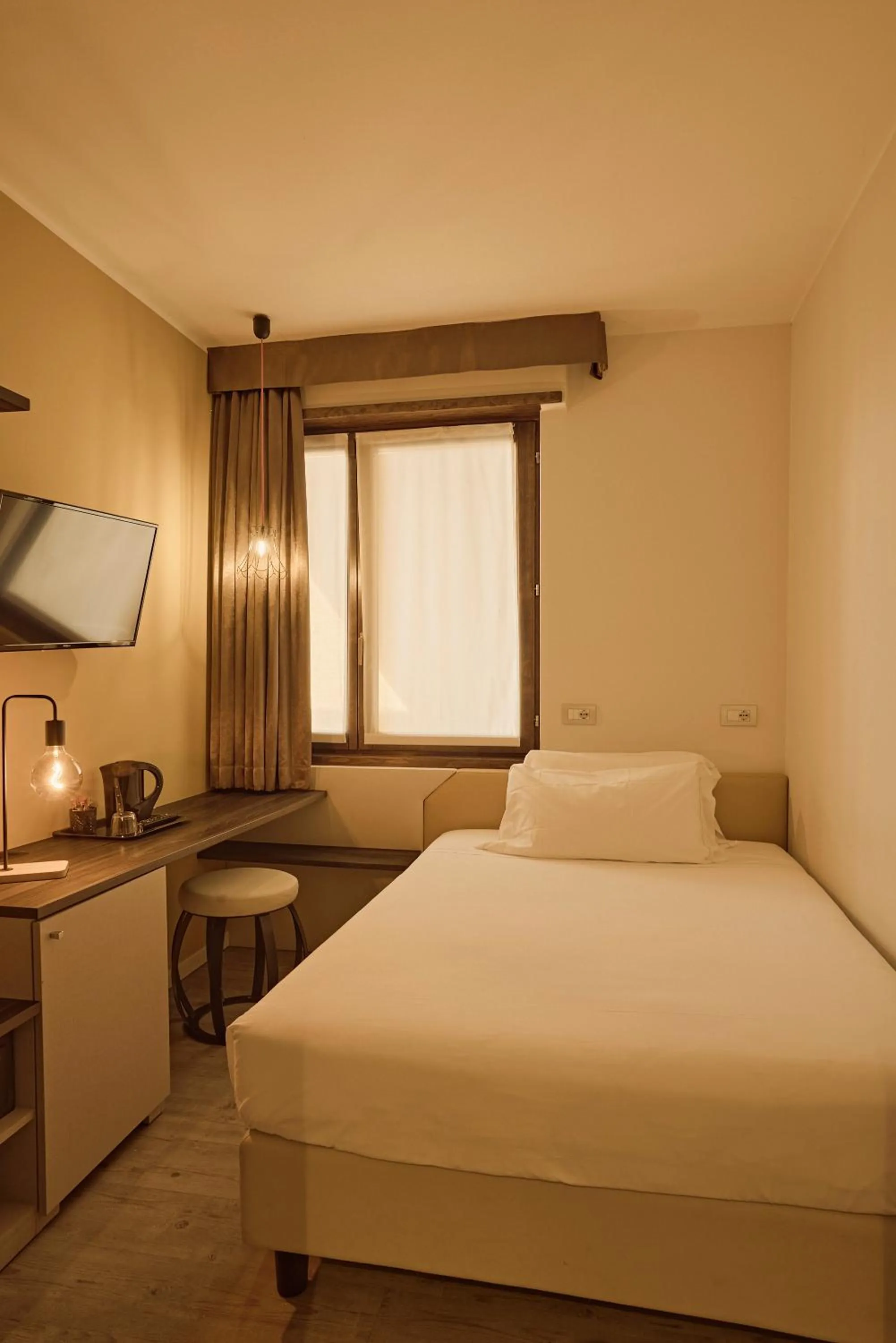 Bed in Hotel Le Mura