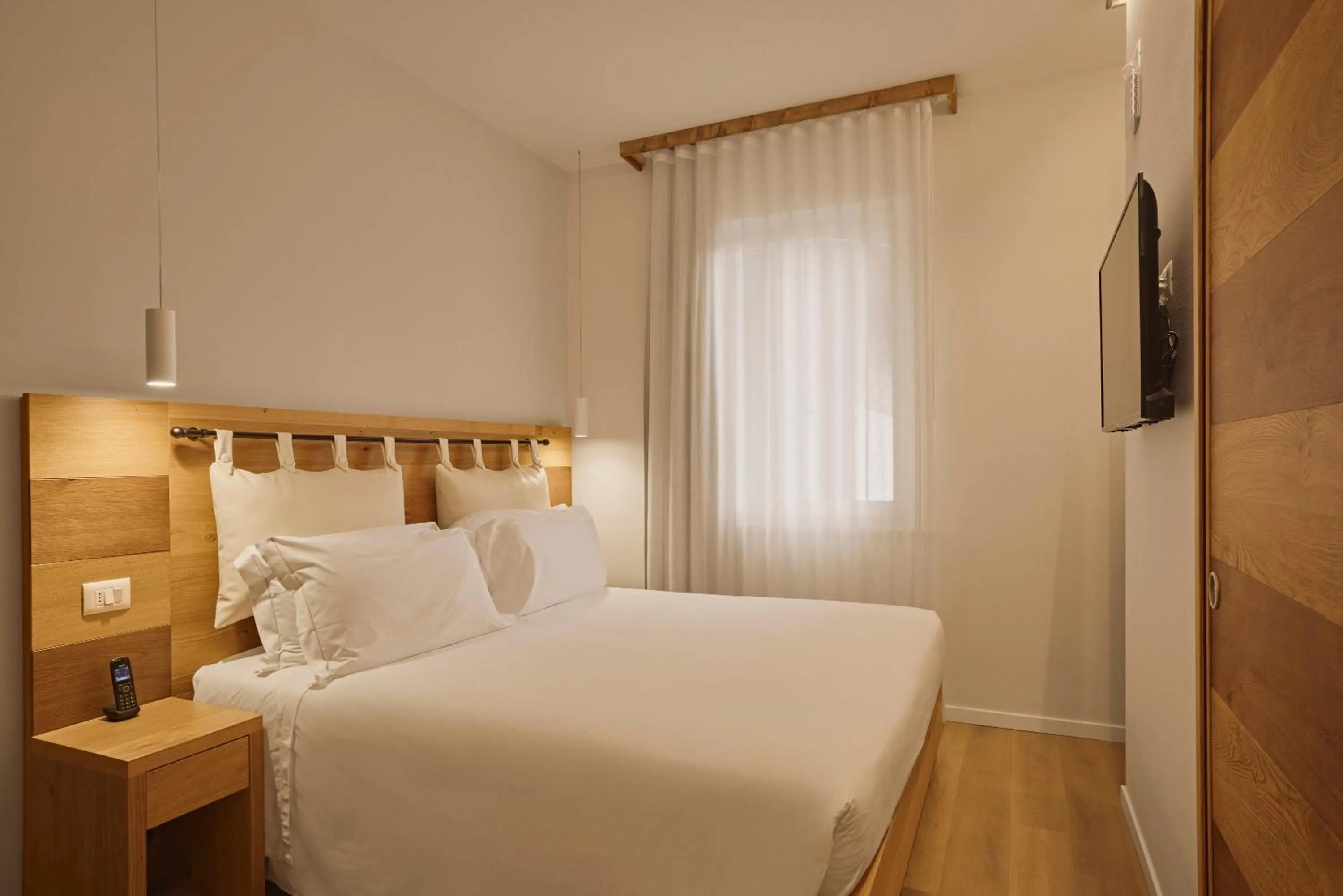 Bed in Hotel Le Mura