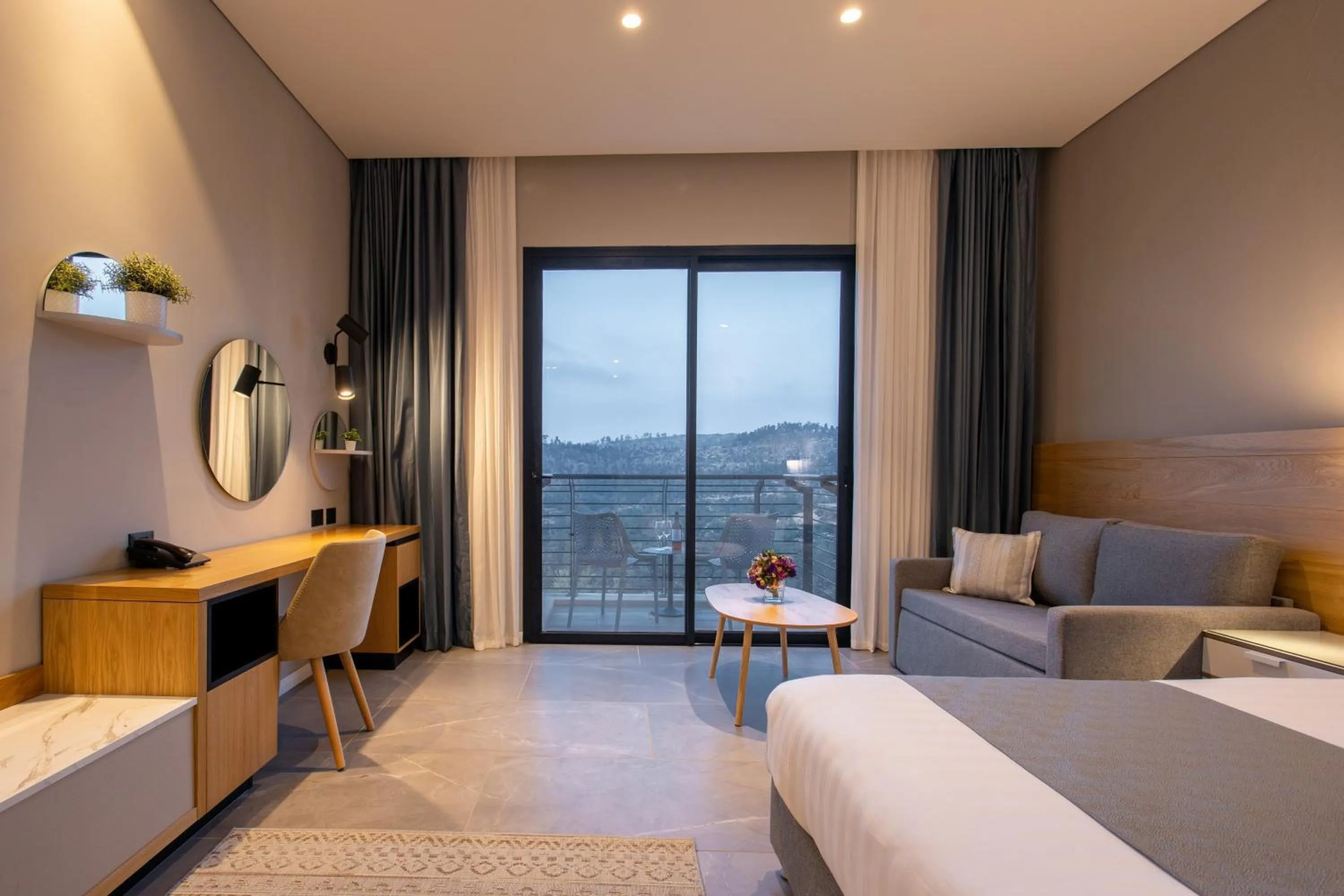 Seating area, Bed in Logos hotel in Yad Hashmona