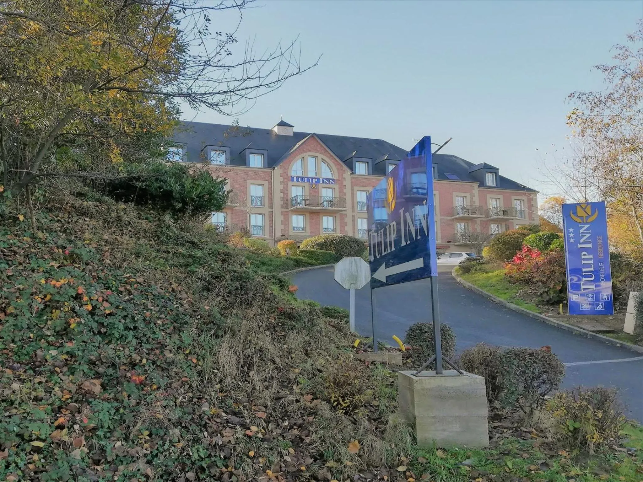 Property logo or sign in Tulip Inn Honfleur Residence &amp; Spa