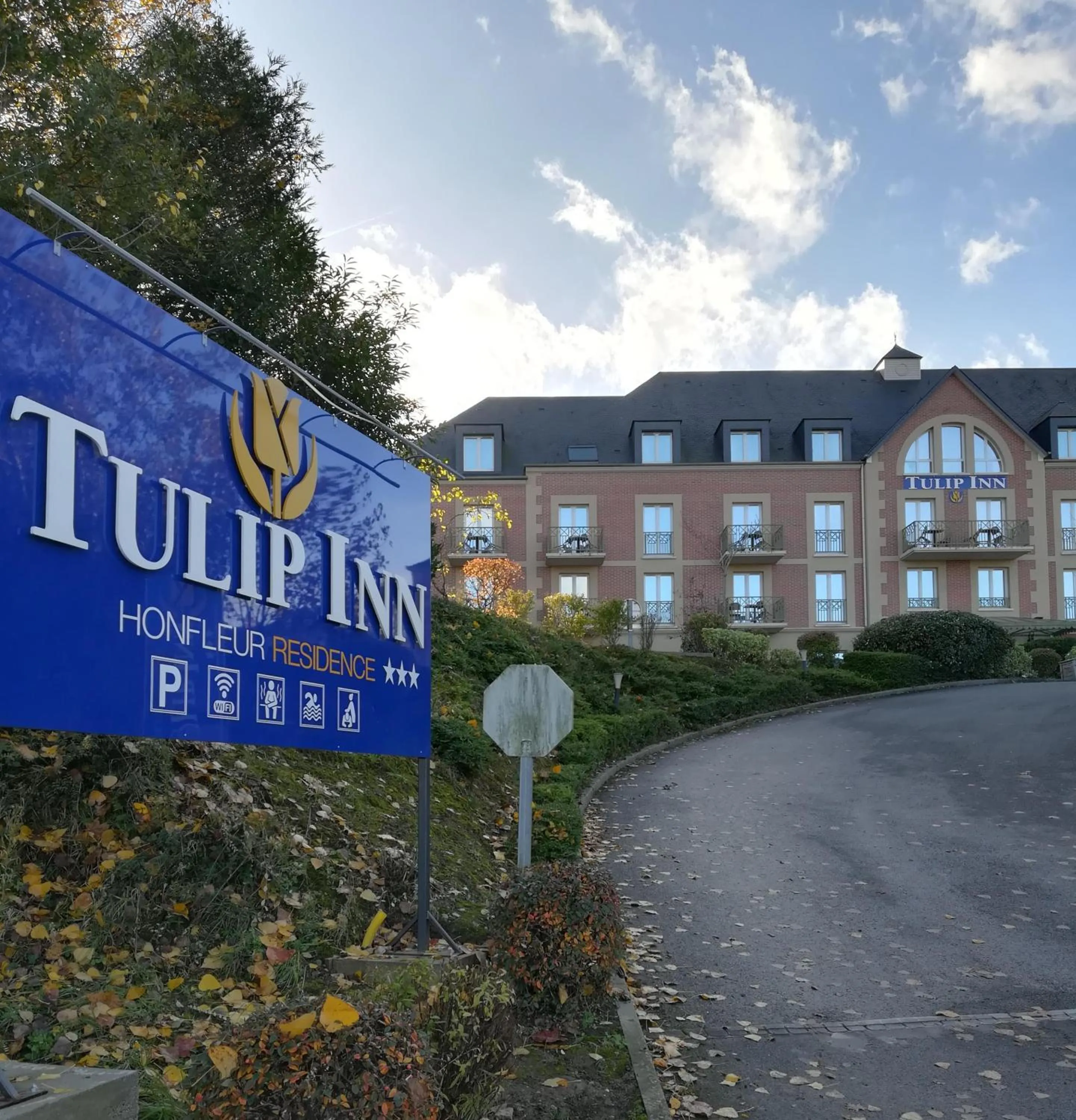 Property logo or sign in Tulip Inn Honfleur Residence &amp; Spa