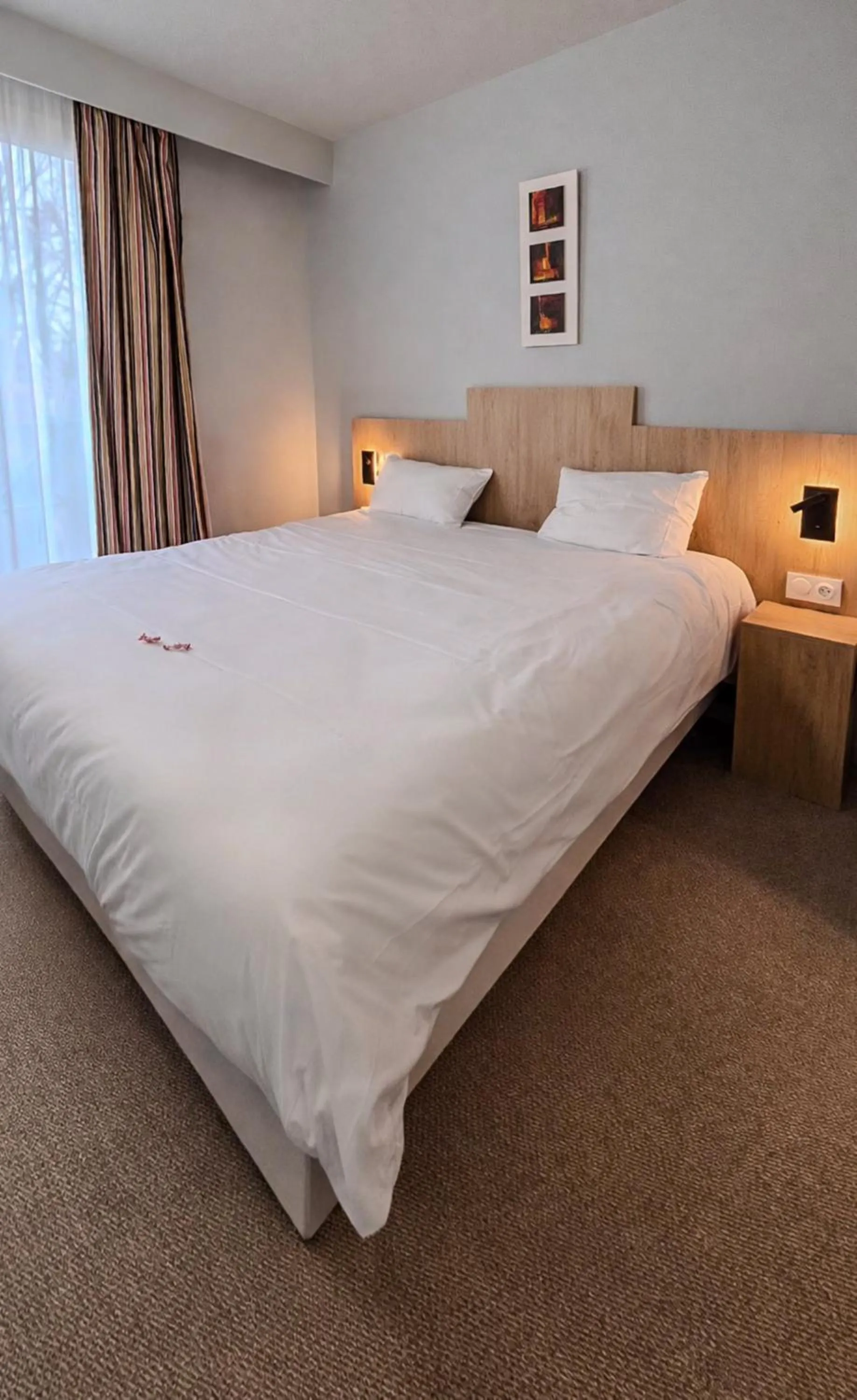 Bed in Tulip Inn Honfleur Residence & Spa