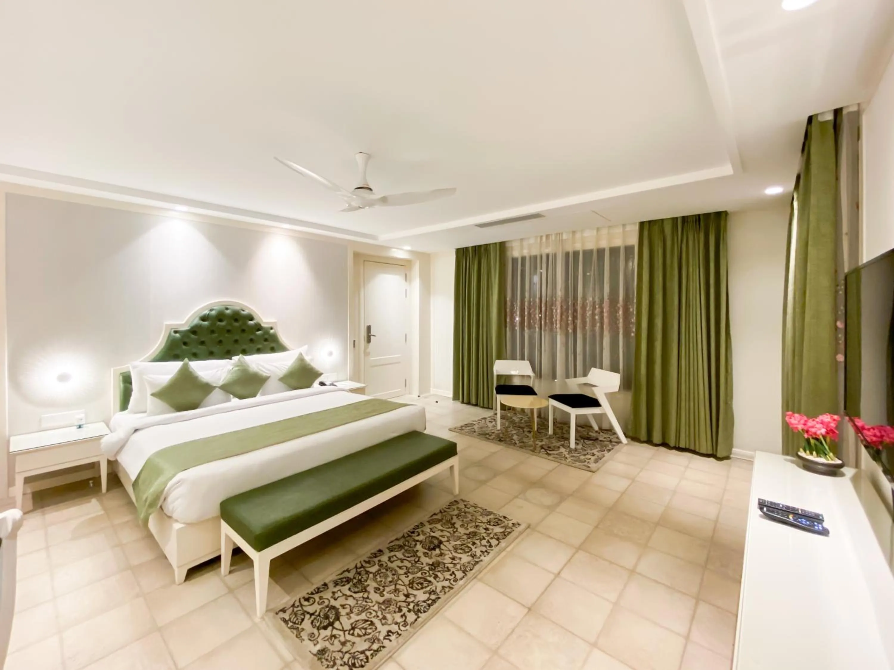 Seating area, Bed in The Greenwood Resort, Guwahati