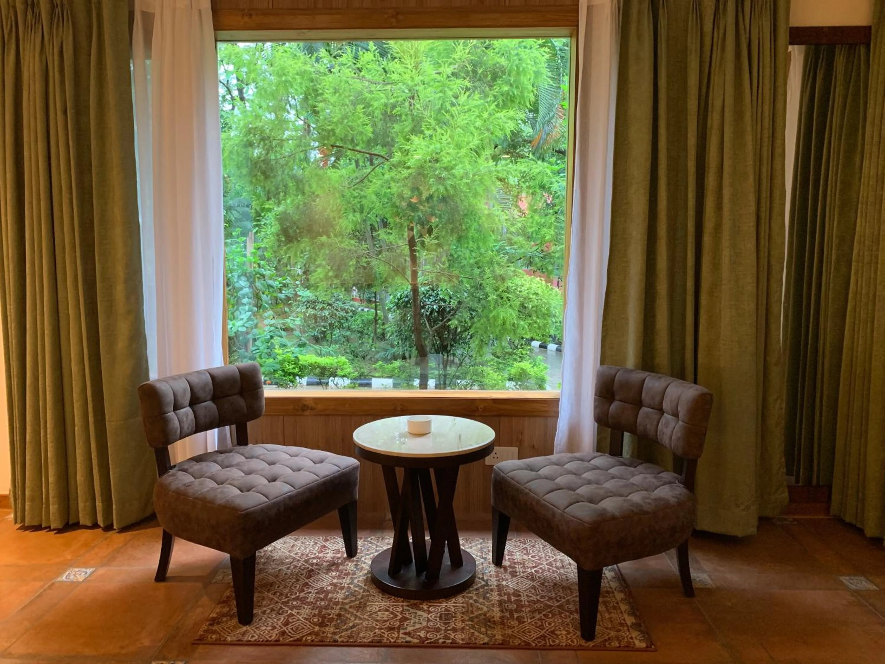Seating area in The Greenwood Resort, Guwahati