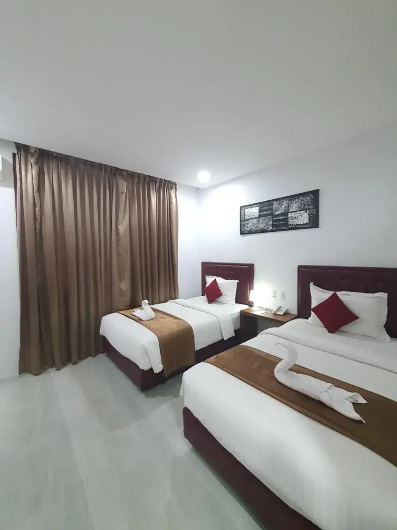 Bed in Grand Mahoni Hotel Bed in Grand Mahoni Hotel