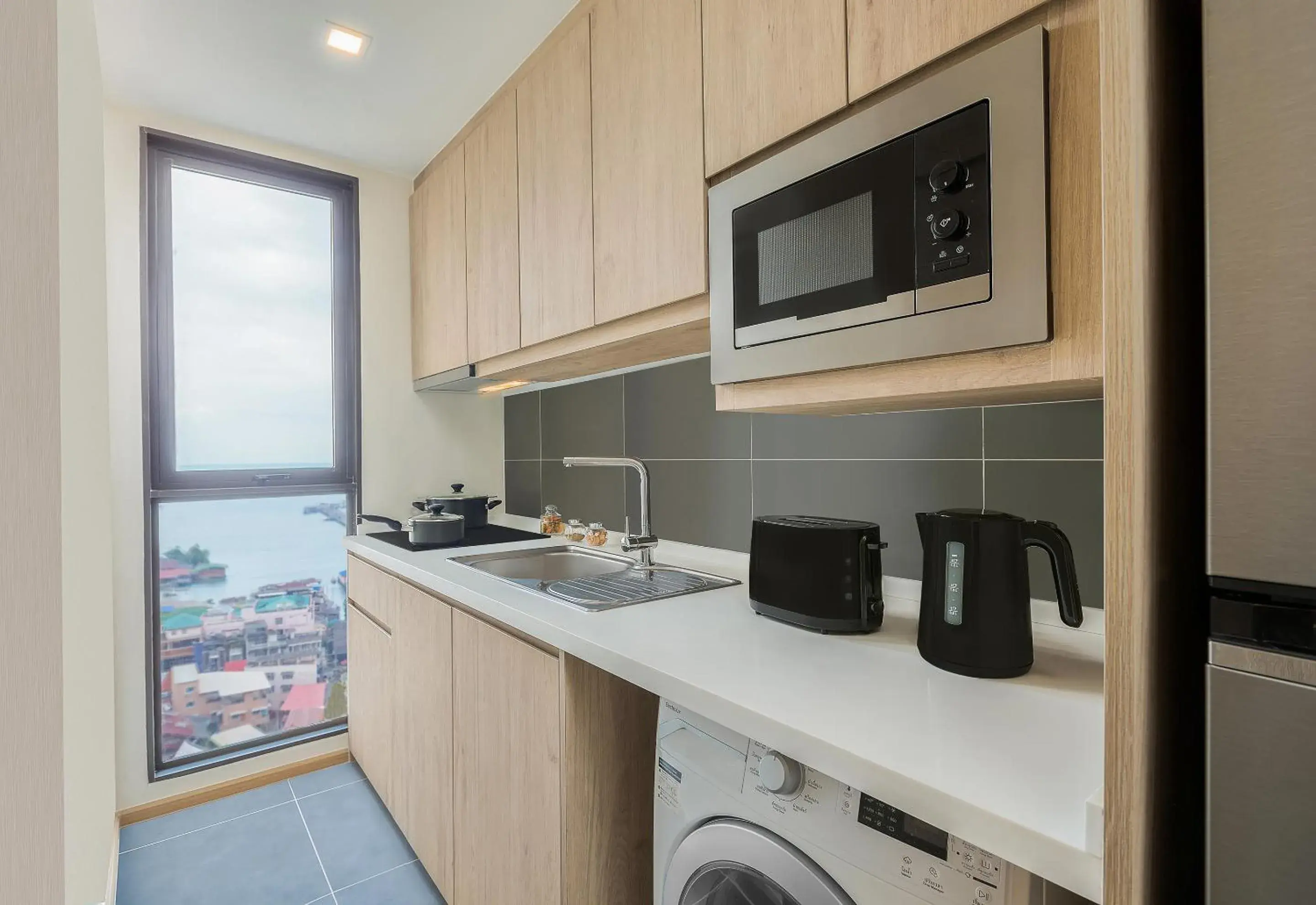 Kitchen or kitchenette in Somerset Harbourview Sri Racha Kitchen or kitchenette in Somerset Harbourview Sri Racha