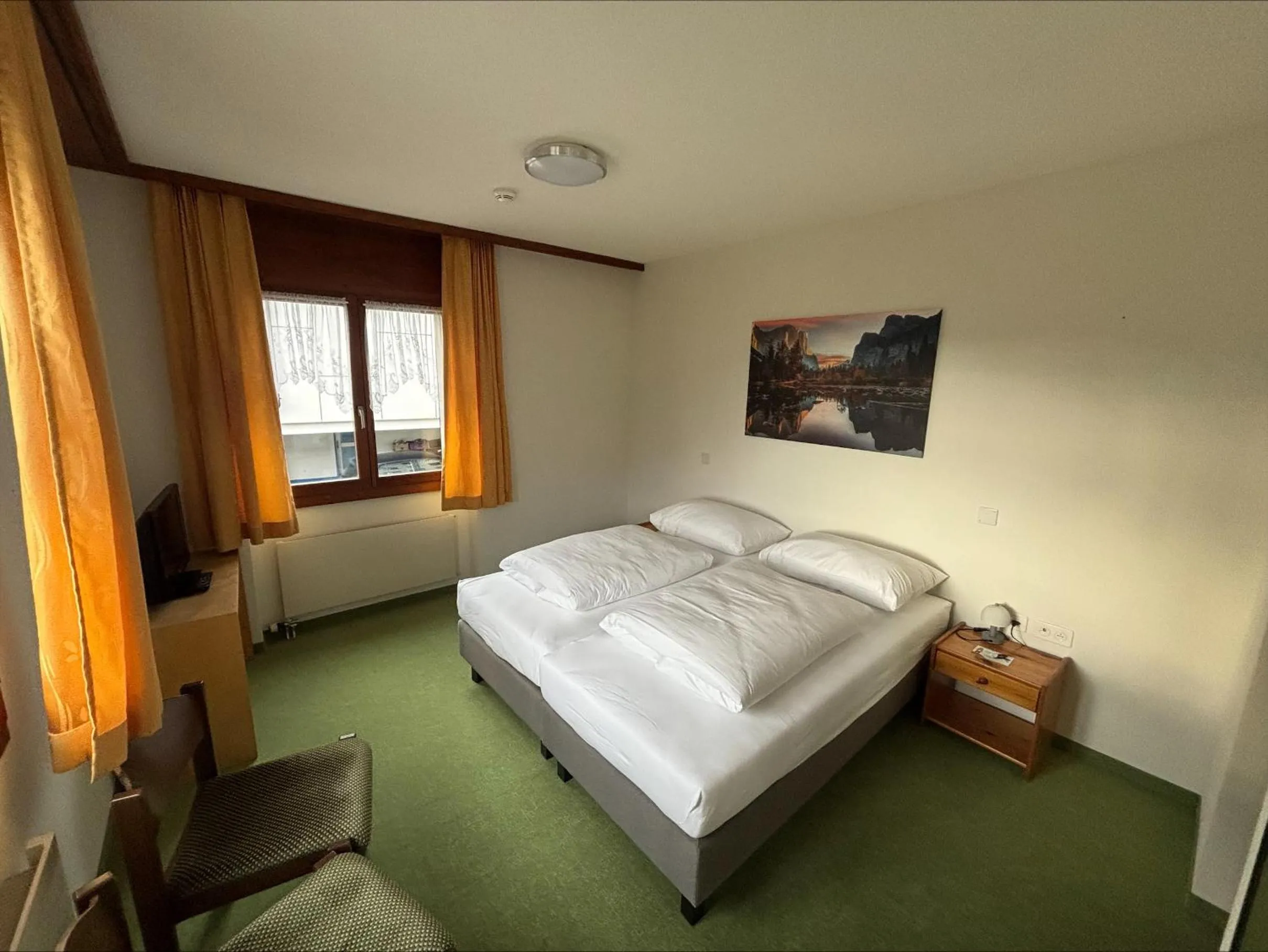 Bedroom, Bed in Hirschen Guesthouse - Village Hotel