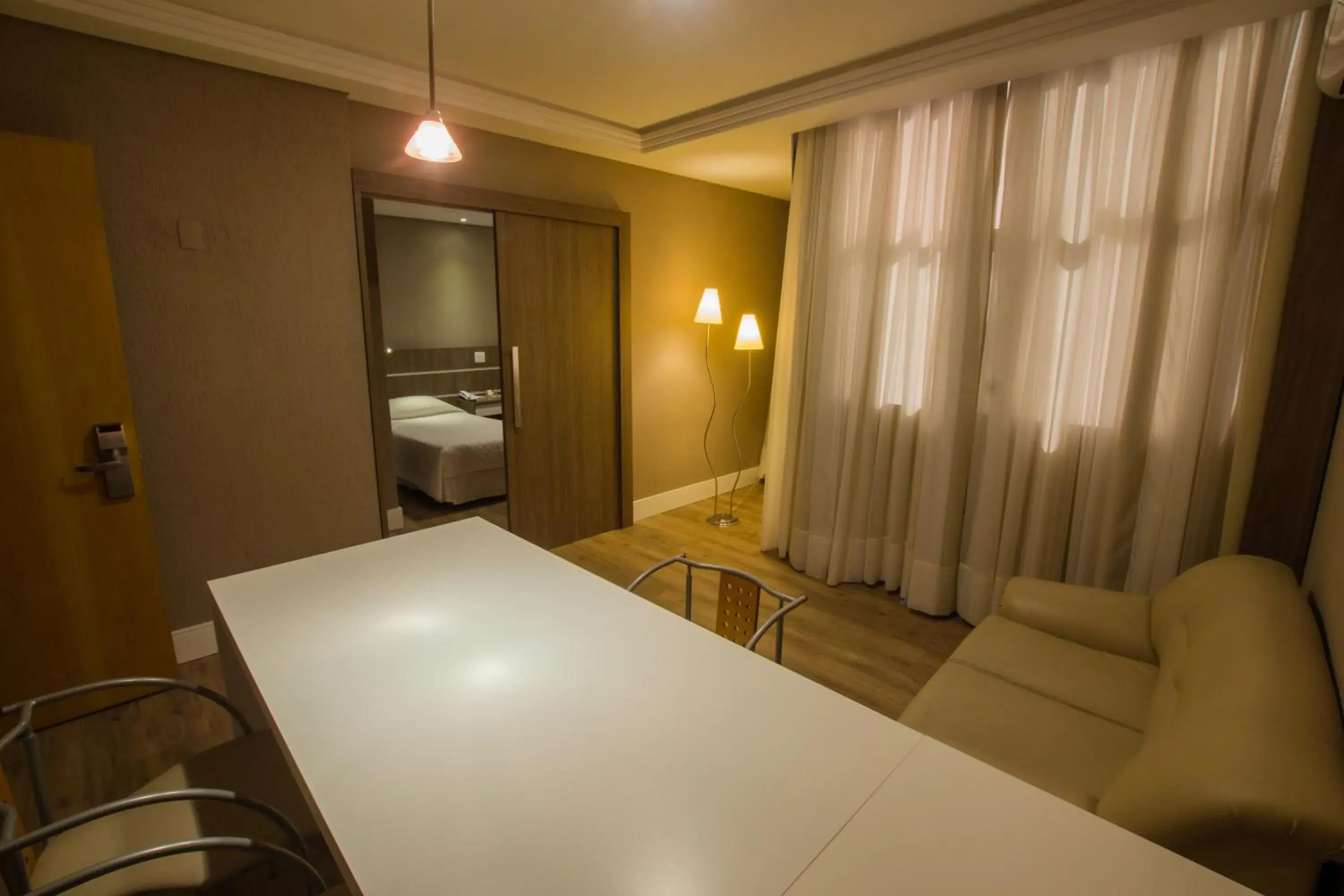 Communal lounge/ TV room, Bed in SJ Royal - San Juan Curitiba Communal lounge/ TV room, Bed in SJ Royal - San Juan Curitiba