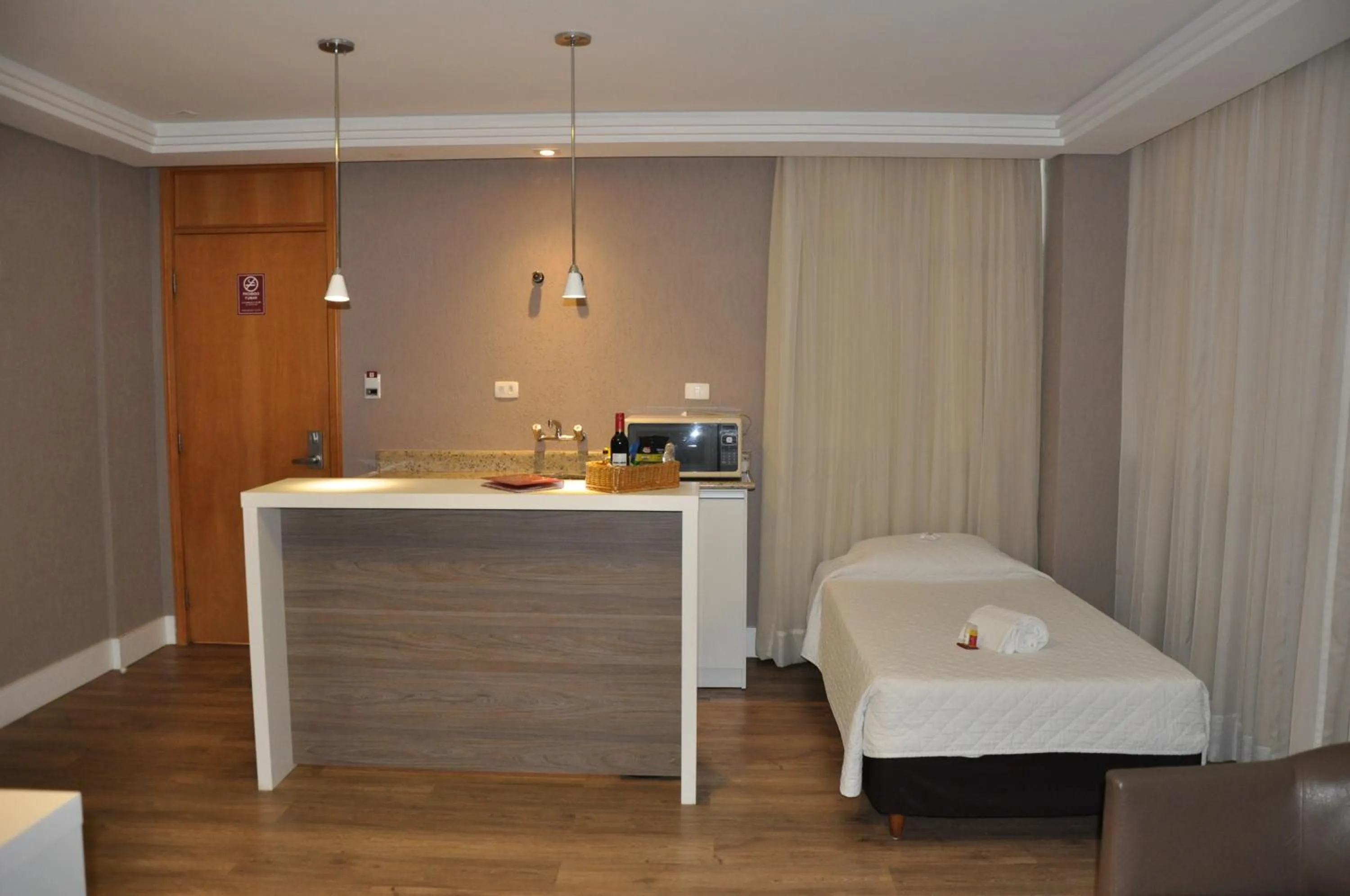 Bed in SJ Royal - San Juan Curitiba